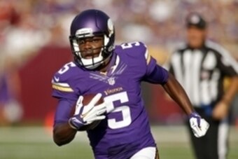 Sep 28, 2014; Minneapolis, MN, USA; Minnesota Vikings quarterback Teddy Bridgewater (5) scrambles for a 13 yard touchdown against the Atlanta Falcons in the second quarter at TCF Bank Stadium. The Vikings win 41-28. Mandatory Credit: Bruce Kluckhohn-USA T