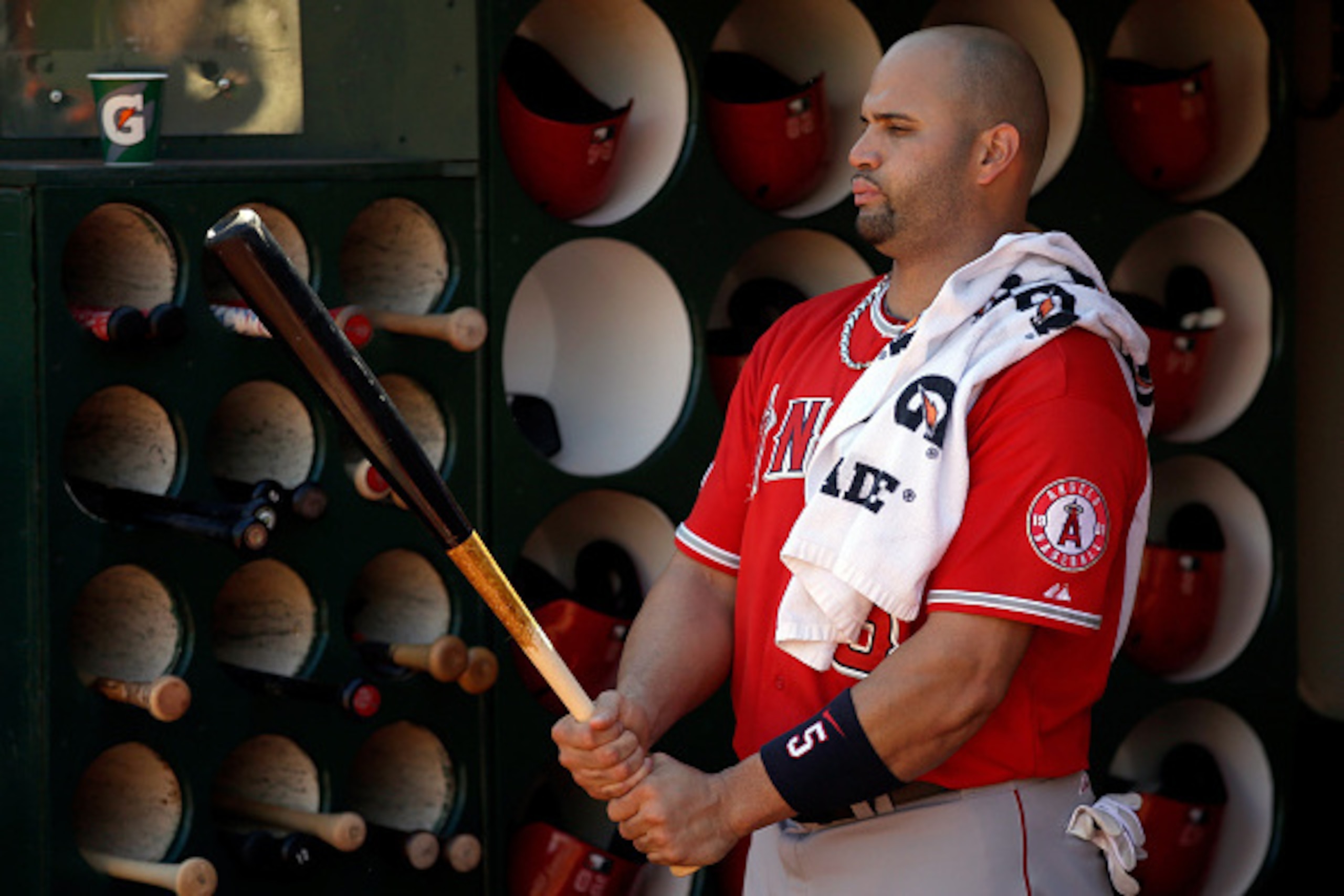OAKLAND, CA - SEPTEMBER 24:  Albert Pujols #5 of the Los Angeles Angels of Anaheim stands in the dugout before their game against the Oakland Athletics at O.co Coliseum on September 24, 2014 in Oakland, California.  (Photo by Ezra Shaw/Getty Images)