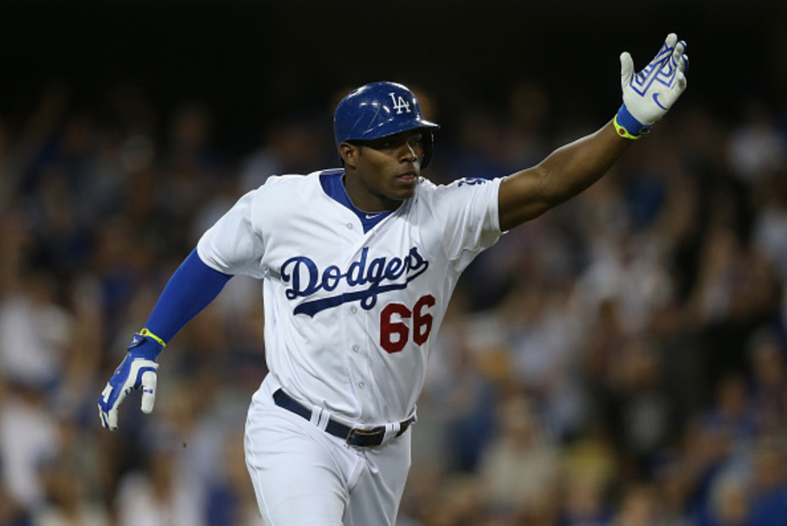 LOS ANGELES, CA - SEPTEMBER 24:  Yasiel Puig #66 of the Los Angeles Dodgers celebrates after hitting a solo home run against the San Francisco Giants in the sixth inning at Dodger Stadium on September 24, 2014 in Los Angeles, California.  (Photo by Jeff G