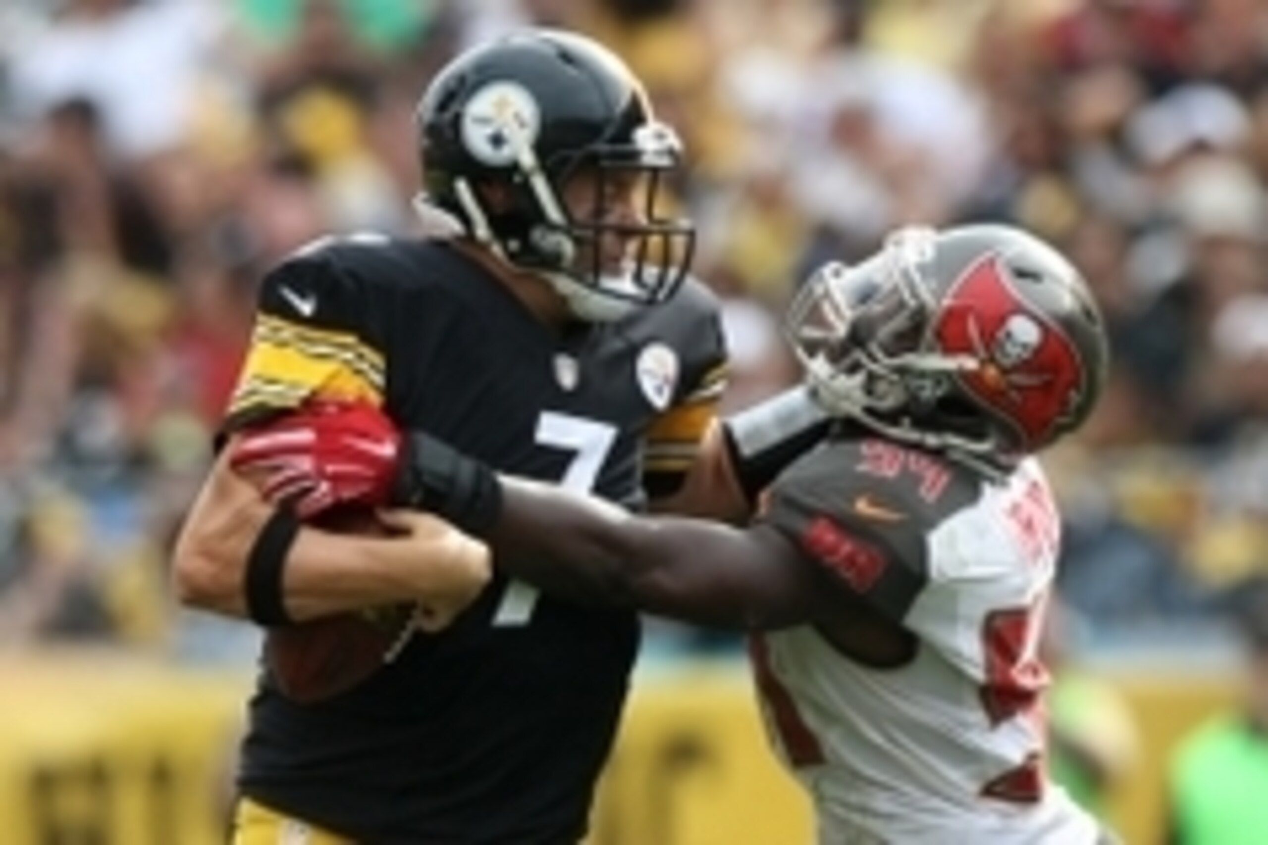 Sep 28, 2014; Pittsburgh, PA, USA; Pittsburgh Steelers quarterback Ben Roethlisberger (7) is tackled by Tampa Bay Buccaneers linebacker Lavontae David (54) during the second half at Heinz Field. The Buccaneers won the game, 27-24. Mandatory Credit: Jason 
