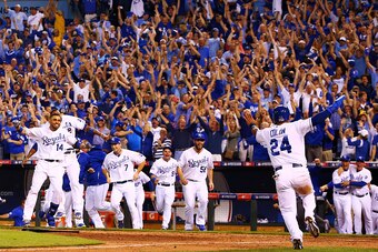 KANSAS CITY, MO - SEPTEMBER 30:  The Kansas City Royals celebrate their 9 to 8 win over the Oakland Athletics in the 12th inning of their American League Wild Card game at Kauffman Stadium on September 30, 2014 in Kansas City, Missouri.  (Photo by Dilip V