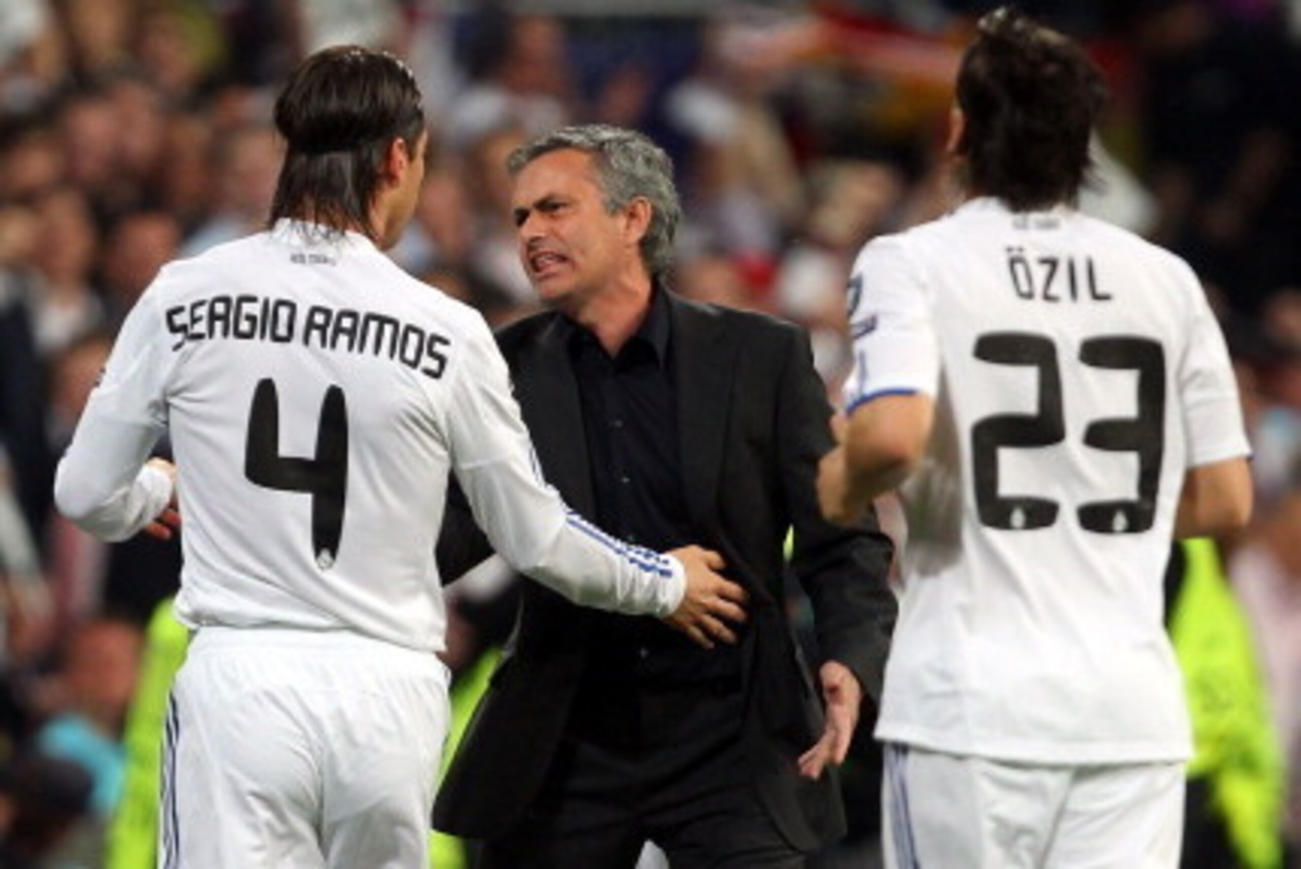MADRID, SPAIN - APRIL 05:  Jose Mourinho of Real Madrid reacts to Sergio Ramos after Emmanuel Adebayor scores the opener the UEFA Champions League Quarter Final first leg match between Real Madrid and Tottenham Hotspur at Estadio Santiago Bernabeu on Apri