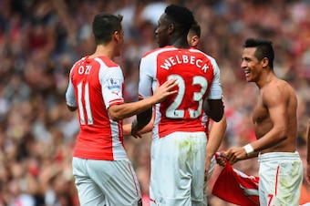 LONDON, ENGLAND - SEPTEMBER 13:  Alexis Sanchez of Arsenal celebrates scoring their second goal with team mates during the Barclays Premier League match between Arsenal and Manchester City at Emirates Stadium on September 13, 2014 in London, England.  (Ph