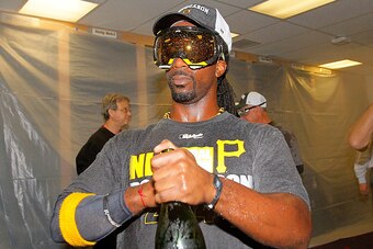 ATLANTA, GA - SEPTEMBER 23:  Andrew McCutchen #22 of the Pittsburgh Pirates celebrates clinching a National League playoff spot after their 3-2 win over the Atlanta Braves at Turner Field on September 23, 2014 in Atlanta, Georgia.  (Photo by Kevin C. Cox/