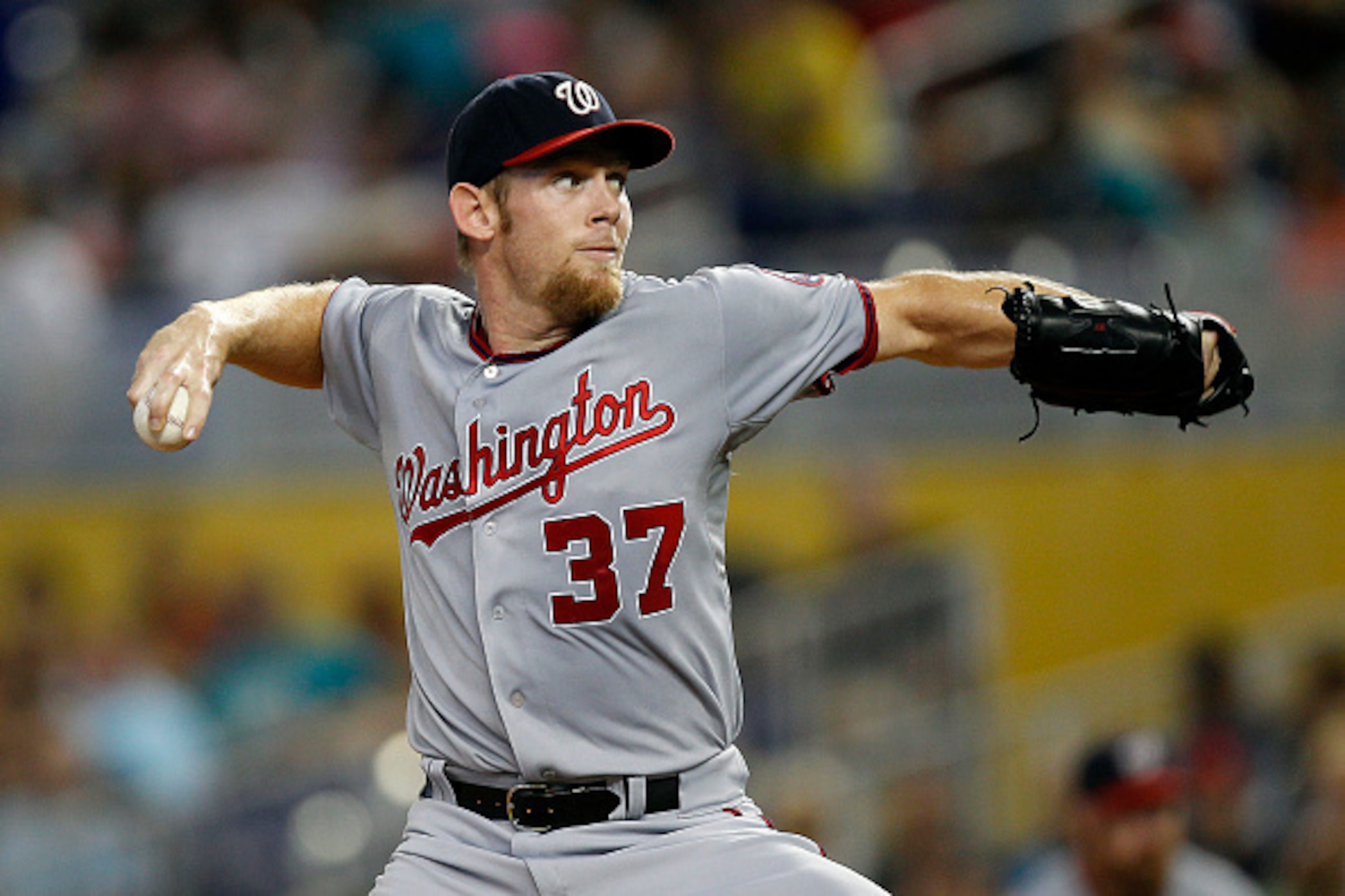 MIAMI, FL - SEPTEMBER 21: Stephen Strasburg #37 of the Washington Nationals delivers a pitch against the Miami Marlins in the first inning at Marlins Park on September 21, 2014 in Miami, Florida. (Photo by Eliot J. Schechter/Getty Images) MIAMI, FL - SEPTEMBER 21: Stephen Strasburg #37 of the Washington Nationals delivers a pitch against the Miami Marlins in the first inning at Marlins Park on September 21, 2014 in Miami, Florida. (Photo by Eliot J. Schechter/Getty Images)