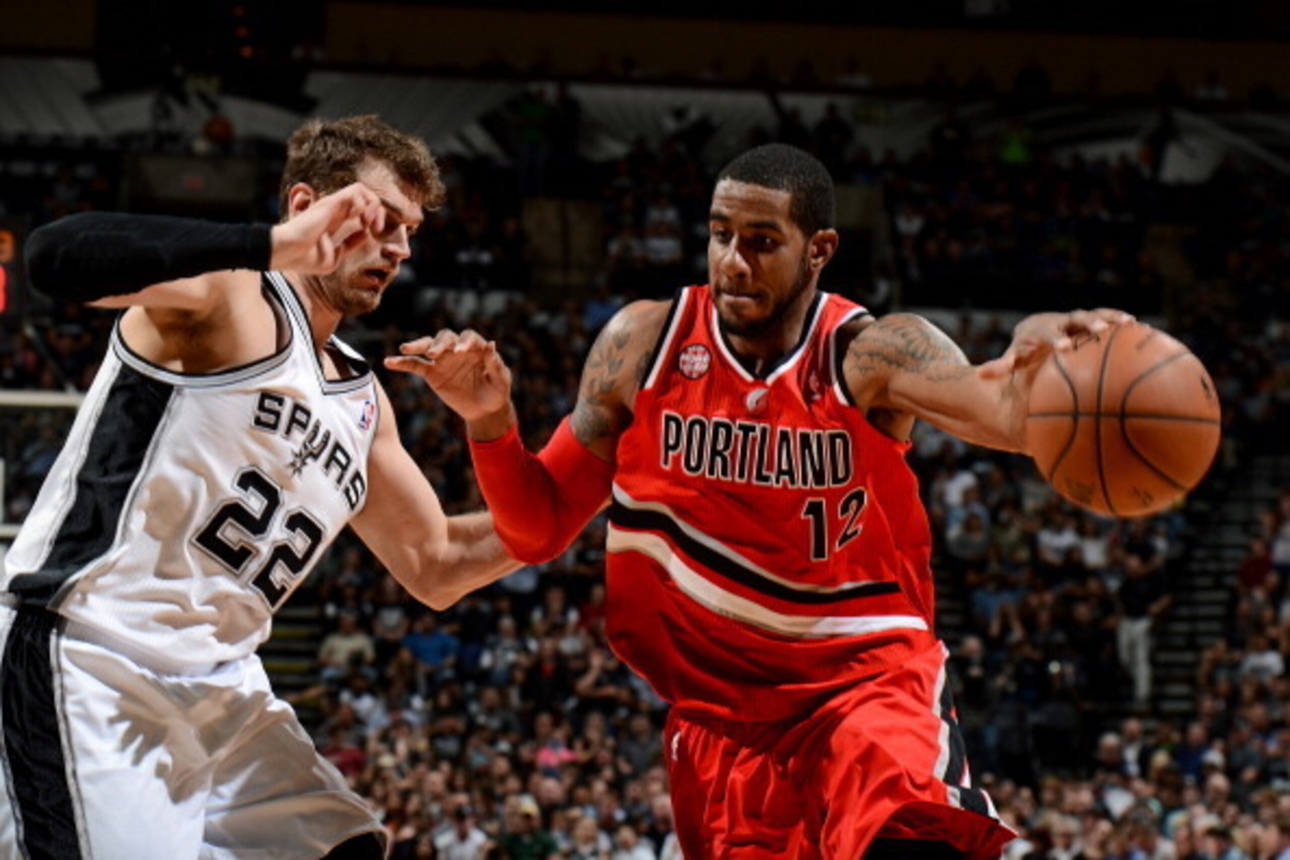 SAN ANTONIO, TX - MAY 14: LaMarcus Aldridge #12 of the Portland Trail Blazers drives against Tiago Splitter #22 of the San Antonio Spurs in Game Five of the Western Conference Semifinals during the 2014 NBA Playoffs on May 14, 2014 at the AT&T Center in S