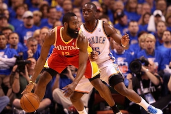 OKLAHOMA CITY, OK - MAY 01:  James Harden #13 of the Houston Rockets handles the ball guarded by Reggie Jackson #15 of the Oklahoma City Thunder during the first half of Game Five of the Western Conference Quarterfinals of the 2013 NBA Playoffs at Chesape