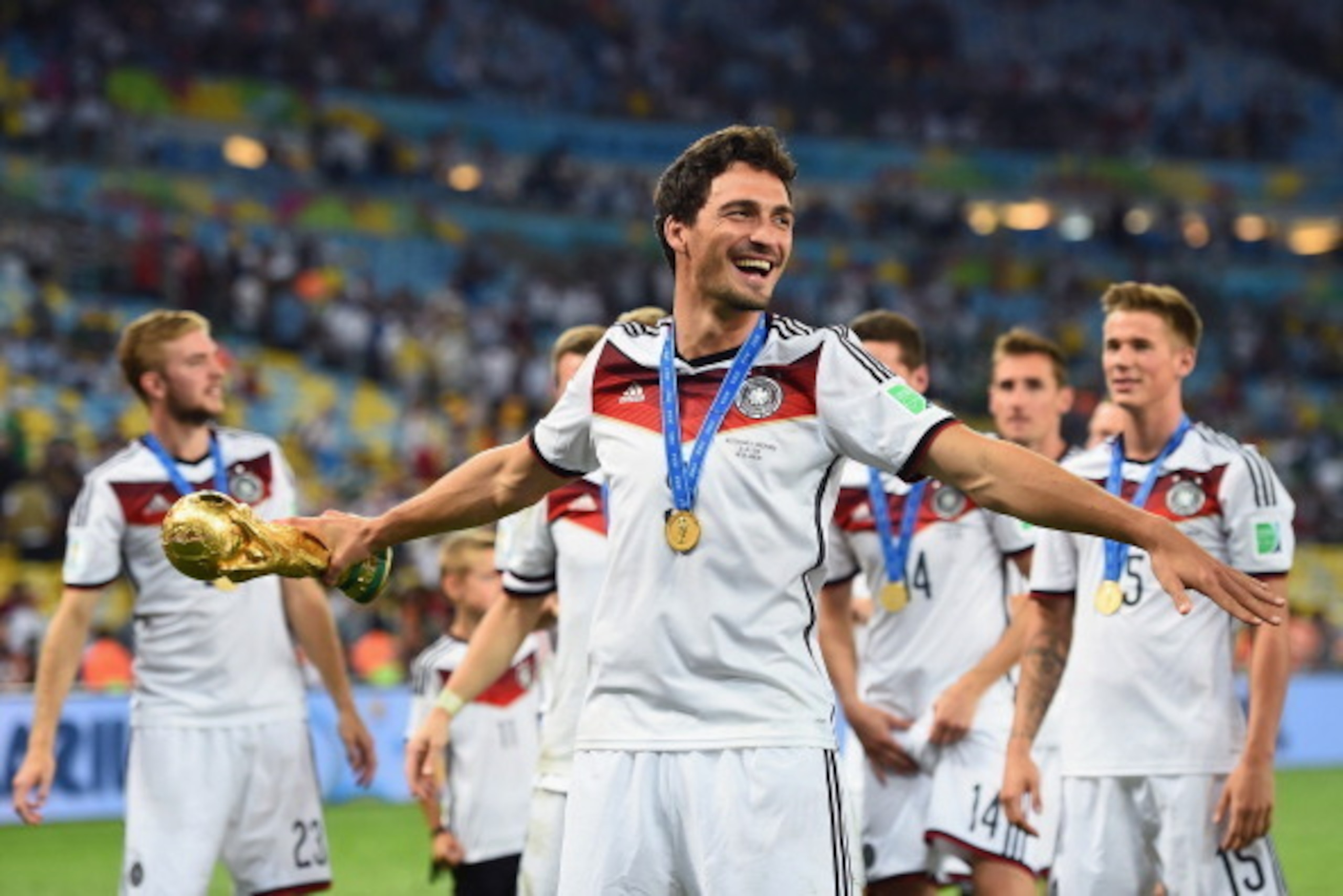 RIO DE JANEIRO, BRAZIL - JULY 13: Mats Hummels of Germany celebrates with the World Cup trophy after defeating Argentina 1-0 in extra time during the 2014 FIFA World Cup Brazil Final match between Germany and Argentina at Maracana on July 13, 2014 in Rio 