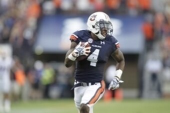 Sep 27, 2014; Auburn, AL, USA;  Auburn Tigers receiver Quan Bray (4) returns a punt for a touchdown during the second half against the Louisiana Tech Bulldogs at Jordan Hare Stadium. Mandatory Credit: John Reed-USA TODAY Sports