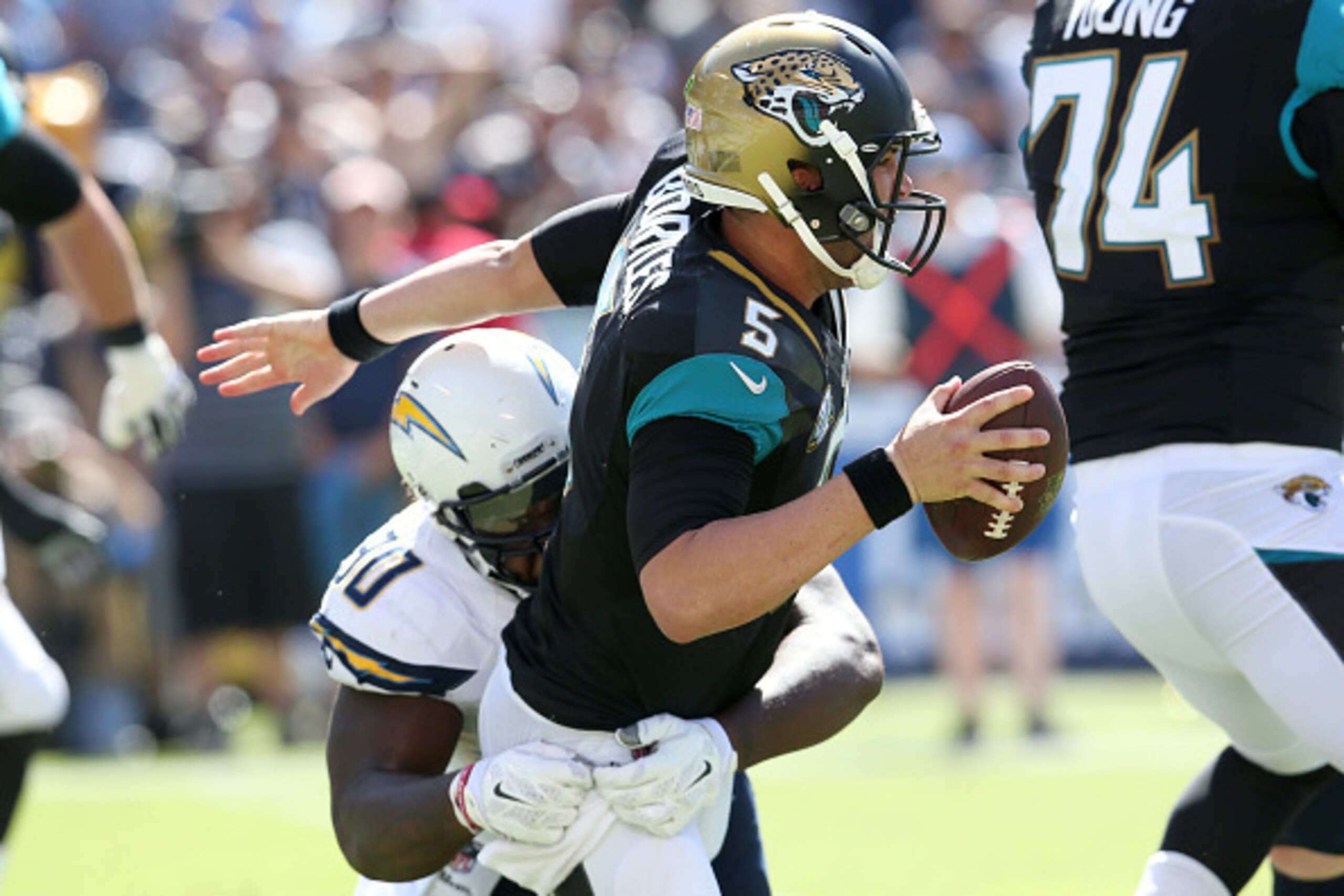 SAN DIEGO, CA - SEPTEMBER 28: Quarterback Blake Bortles #5 of the Jacksonville Jaguars is tackled by defensive lineman Ricardo Mathews #90 of the San Diego Chargers at Qualcomm Stadium on September 28, 2014 in San Diego, California. (Photo by Stephen Du SAN DIEGO, CA - SEPTEMBER 28: Quarterback Blake Bortles #5 of the Jacksonville Jaguars is tackled by defensive lineman Ricardo Mathews #90 of the San Diego Chargers at Qualcomm Stadium on September 28, 2014 in San Diego, California. (Photo by Stephen Du