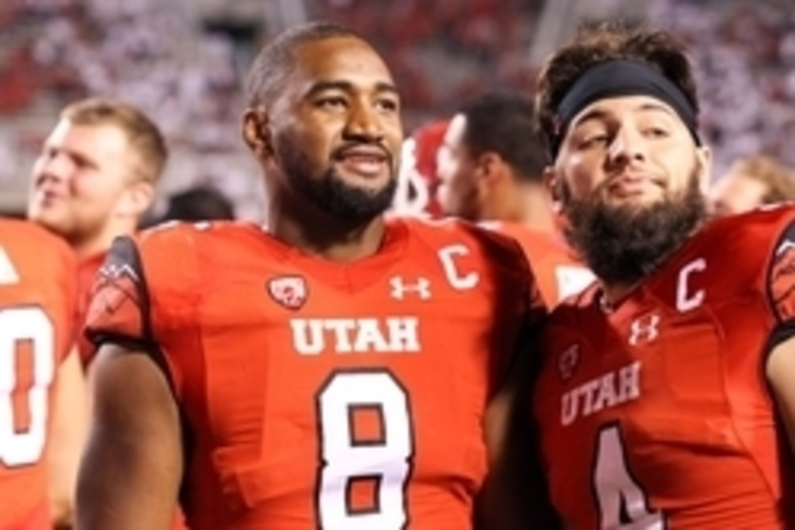 Aug 28, 2014; Salt Lake City, UT, USA; Utah Utes defensive end Nate Orchard (8) and Utah Utes defensive back Brian Blechen (4) look on during the fourth quarter against the Idaho State Bengals at Rice-Eccles Stadium. The Utes won 56-14. Mandatory Credit: 