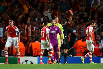 LONDON, ENGLAND - OCTOBER 01:  Wojciech Szczesny of Arsenal receives a red card from referee Gianluca Rocchi during the UEFA Champions League group D match between Arsenal FC and Galatasaray AS at Emirates Stadium on October 1, 2014 in London, United King