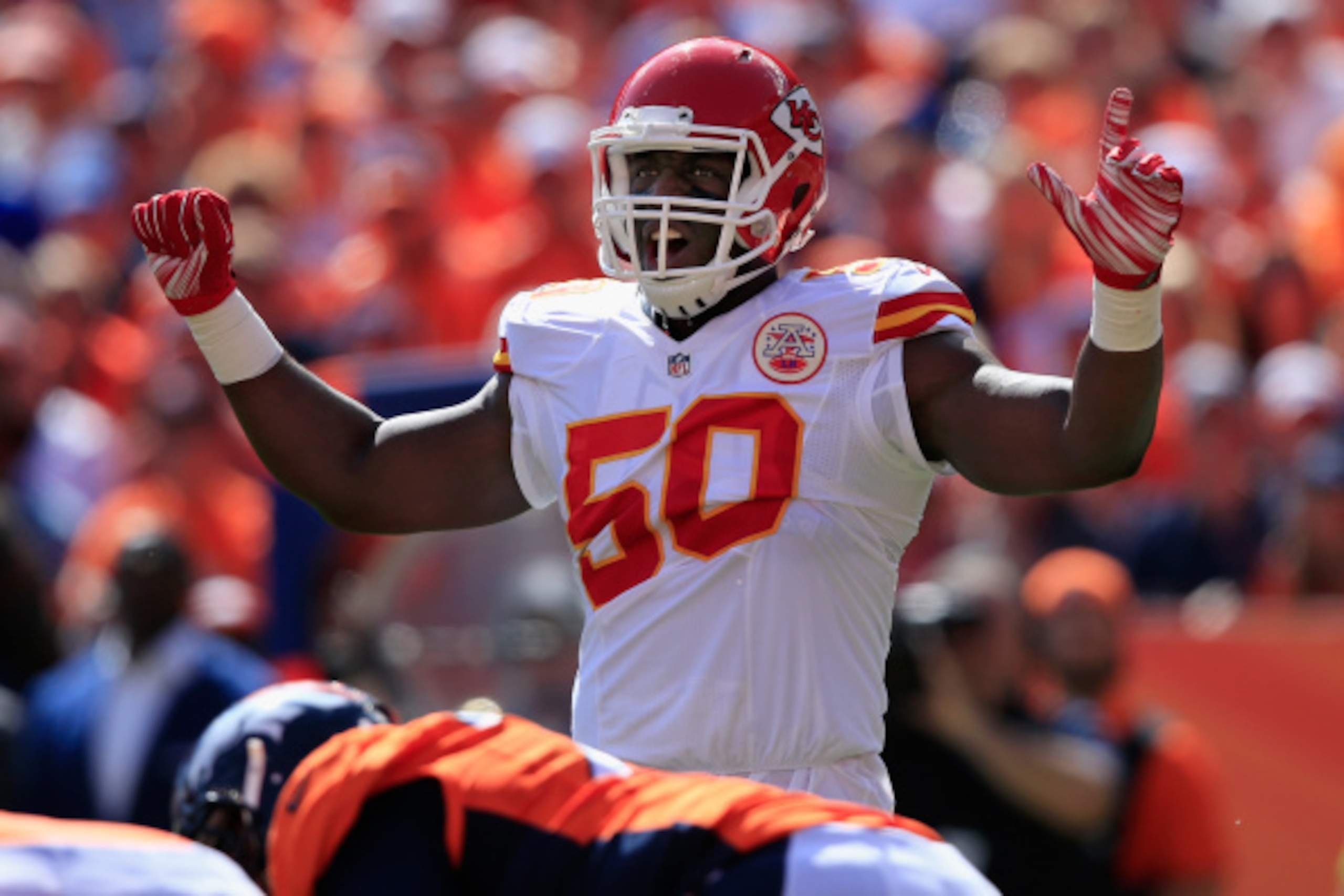 DENVER, CO - SEPTEMBER 14:  Outside linebacker Justin Houston #50 of the Kansas City Chiefs faces the Denver Broncos at Sports Authority Field at Mile High on September 14, 2014 in Denver, Colorado. The Broncos defeated the Chiefs 24-17.  (Photo by Doug P