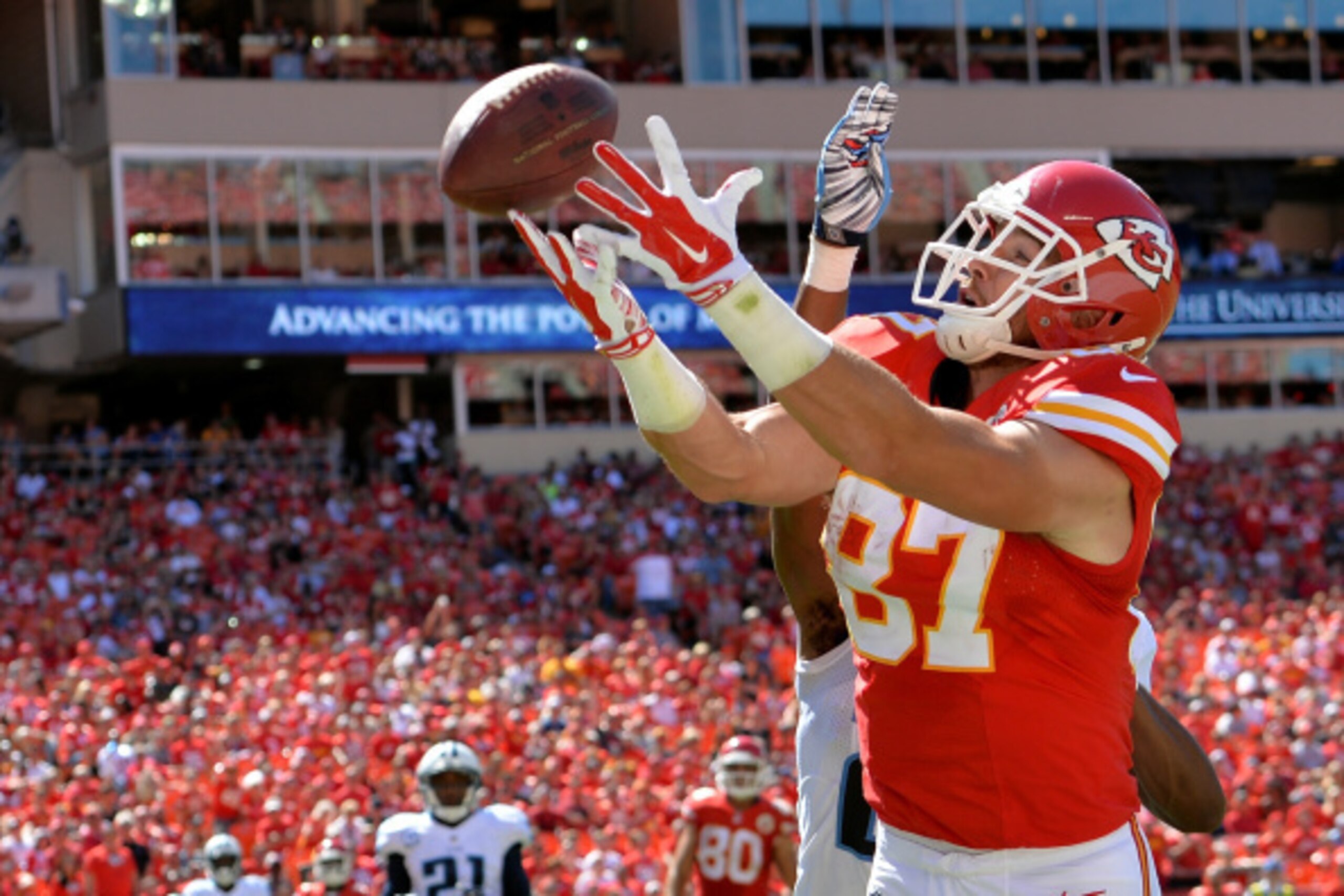 KANSAS CITY, MO - SEPTEMBER 07:  Travis Kelce #87 of the Kansas City Chiefs reaches out for the ball in the endzone as  Blidi Wreh-Wilson #25 of the Tennessee Titans defends during the second half as  at Arrowhead Stadium on September 7, 2014 in Kansas Ci