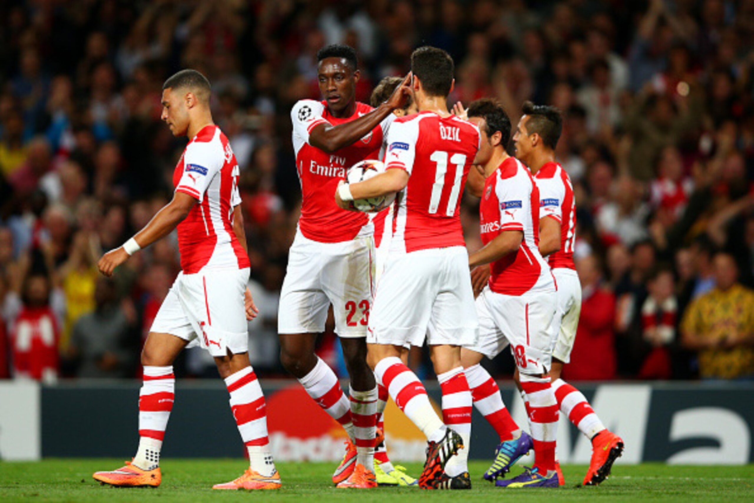 LONDON, ENGLAND - OCTOBER 01:  Danny Welbeck of Arsenal celebrates with team-mates after scoring the opening goal during the UEFA Champions League group D match between Arsenal FC and Galatasaray AS at Emirates Stadium on October 1, 2014 in London, United