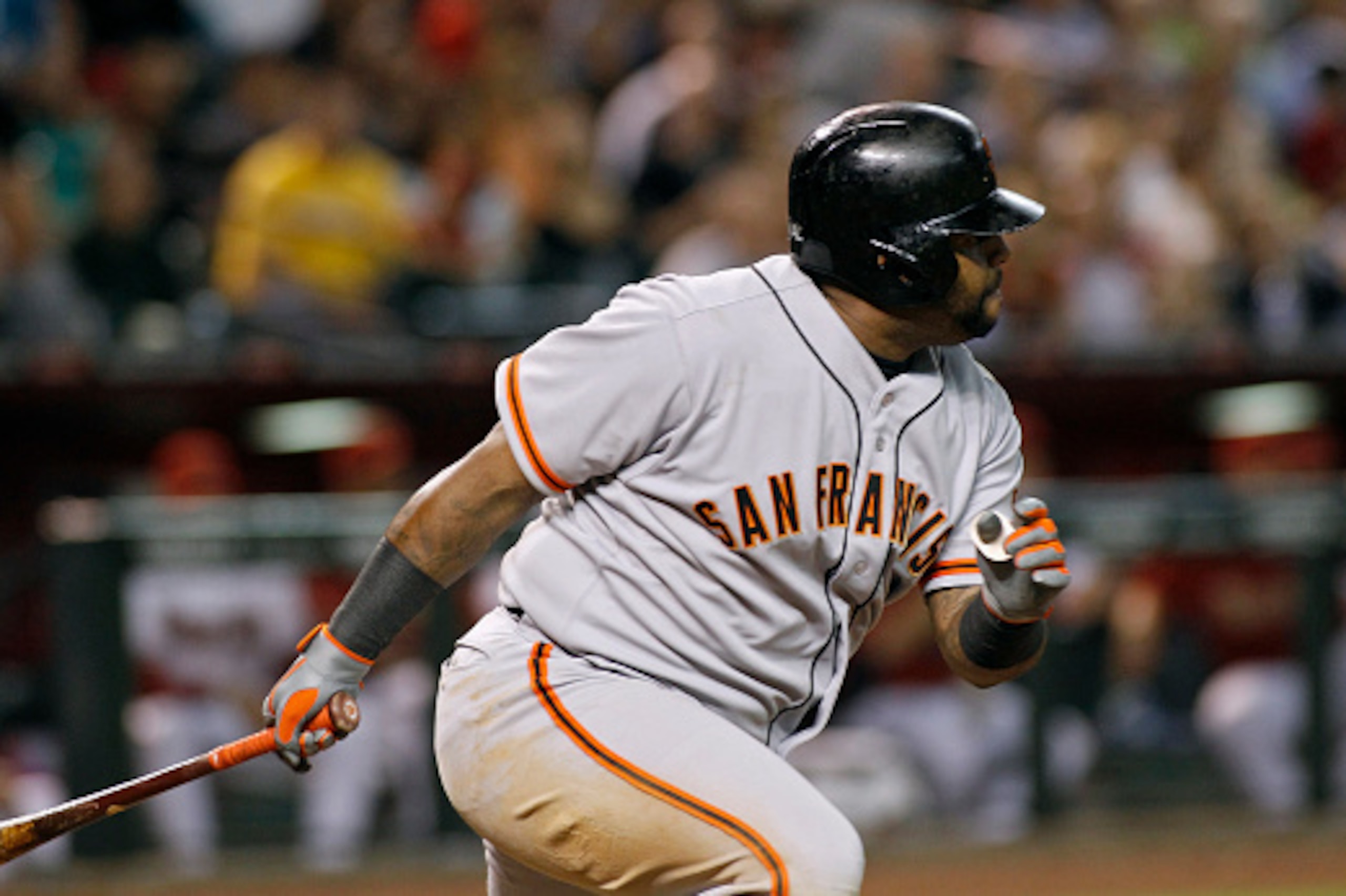PHOENIX, AZ - SEPTEMBER 16:  Pablo Sandoval #48 of the San Francisco Giants hits a ground ball during the sixth inning of a MLB game against the Arizona Diamondbacks at Chase Field on September 16, 2014 in Phoenix, Arizona.  (Photo by Ralph Freso/Getty Im