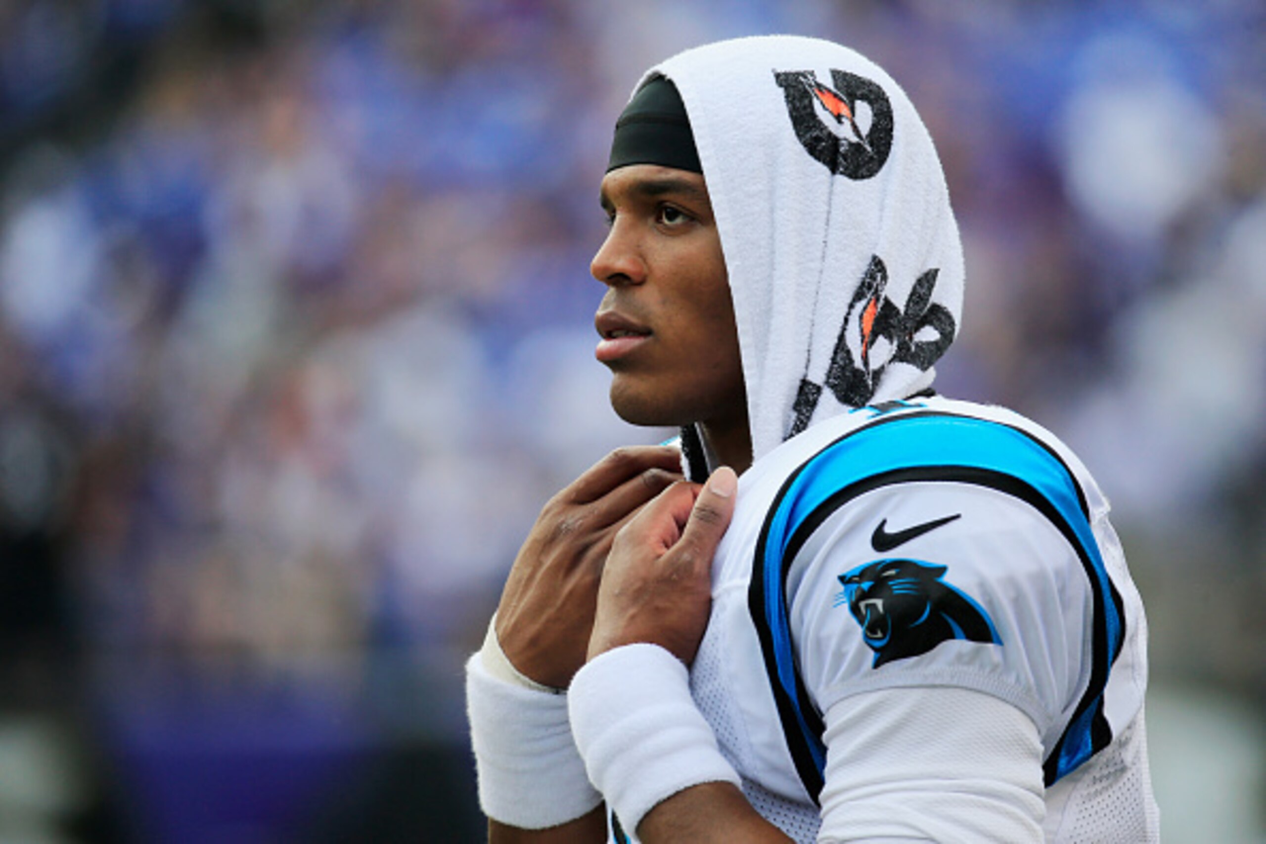 BALTIMORE, MD - SEPTEMBER 28: Quarterback Cam Newton #1 of the Carolina Panthers looks on from the bench during the closing minutes of the Panthers 38-10 loss to the Baltimore Ravens at M&T Bank Stadium on September 28, 2014 in Baltimore, Maryland.  (Phot