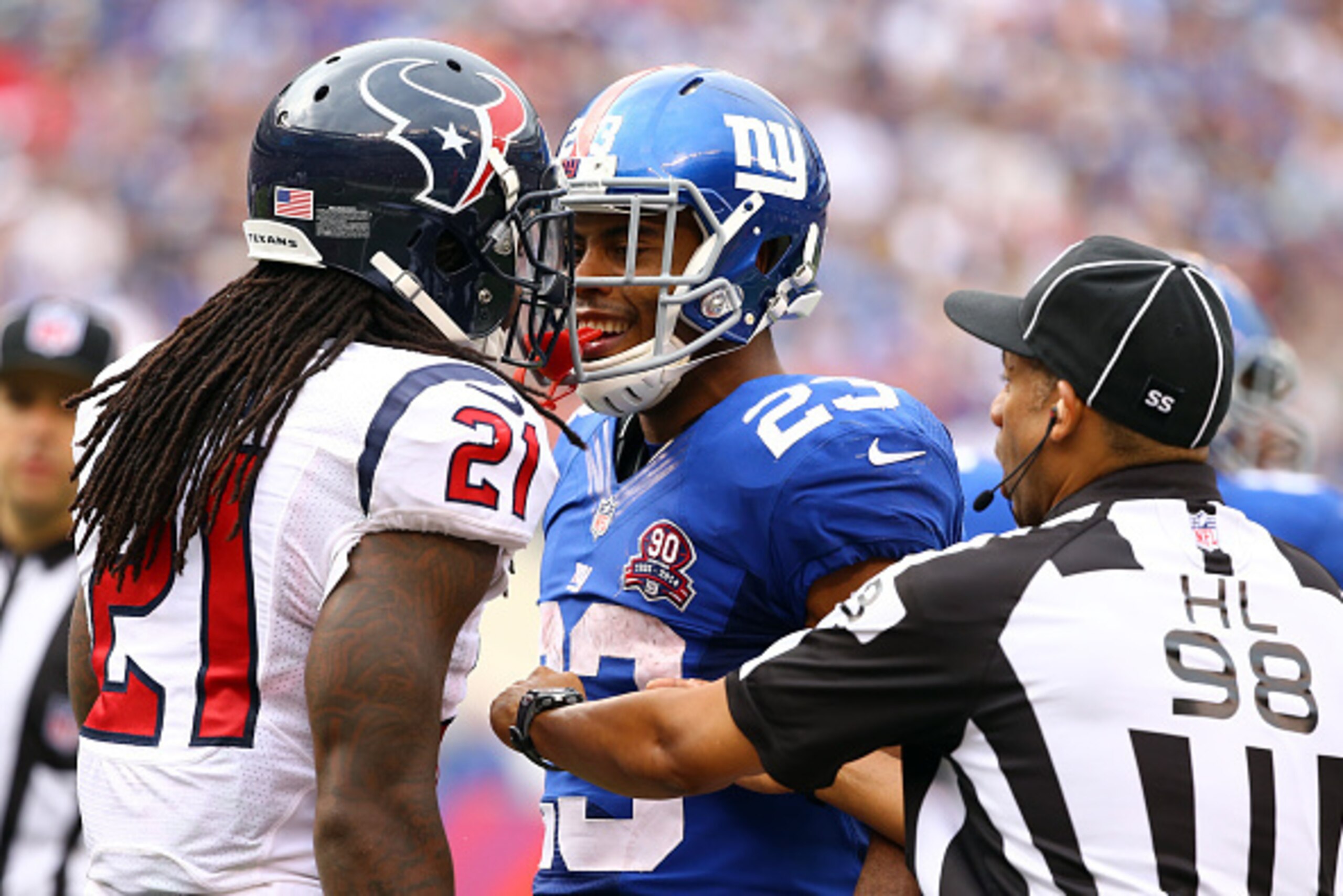 EAST RUTHERFORD, NJ - SEPTEMBER 21:  Rashad Jennings #23 of the New York Giants and  Kendrick Lewis #21 of the Houston Texans exchange words at MetLife Stadium on September 21, 2014 in East Rutherford, New Jersey.  (Photo by Al Bello/Getty Images)