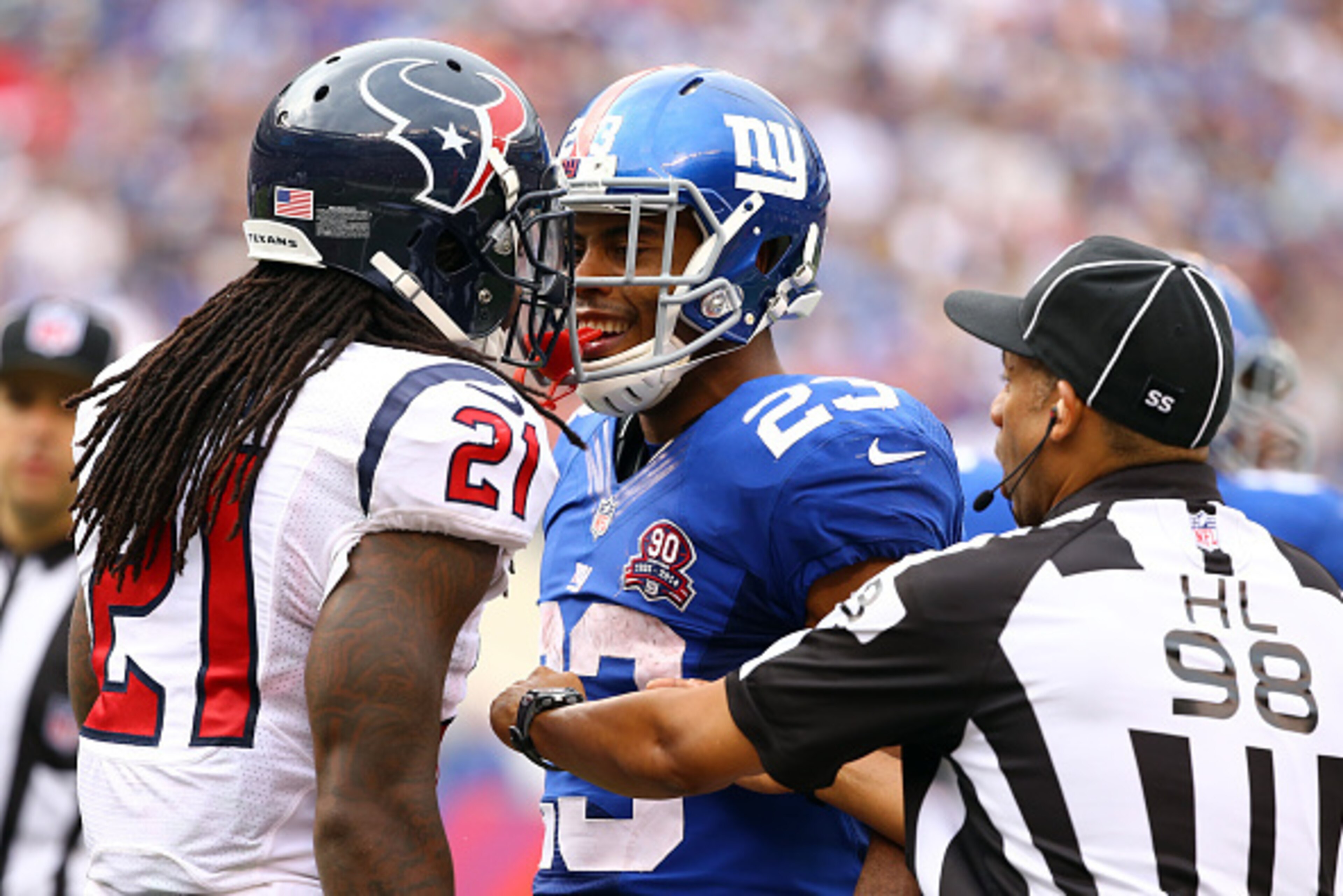 EAST RUTHERFORD, NJ - SEPTEMBER 21:  Rashad Jennings #23 of the New York Giants and  Kendrick Lewis #21 of the Houston Texans exchange words at MetLife Stadium on September 21, 2014 in East Rutherford, New Jersey.  (Photo by Al Bello/Getty Images)