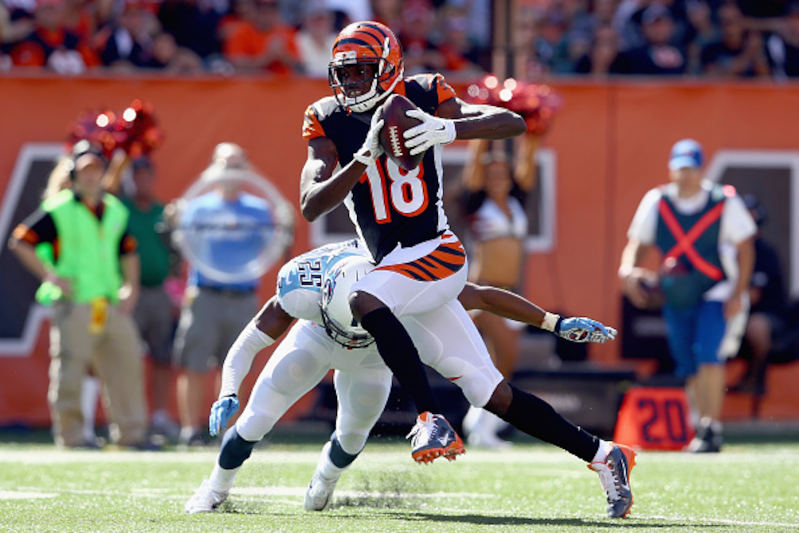 CINCINNATI, OH - SEPTEMBER 21: A.J. Green #18 of the Cincinnati Bengals runs with the ball during the game against the Tennessee Titans at Paul Brown Stadium on September 21, 2014 in Cincinnati, Ohio.  (Photo by Andy Lyons/Getty Images)