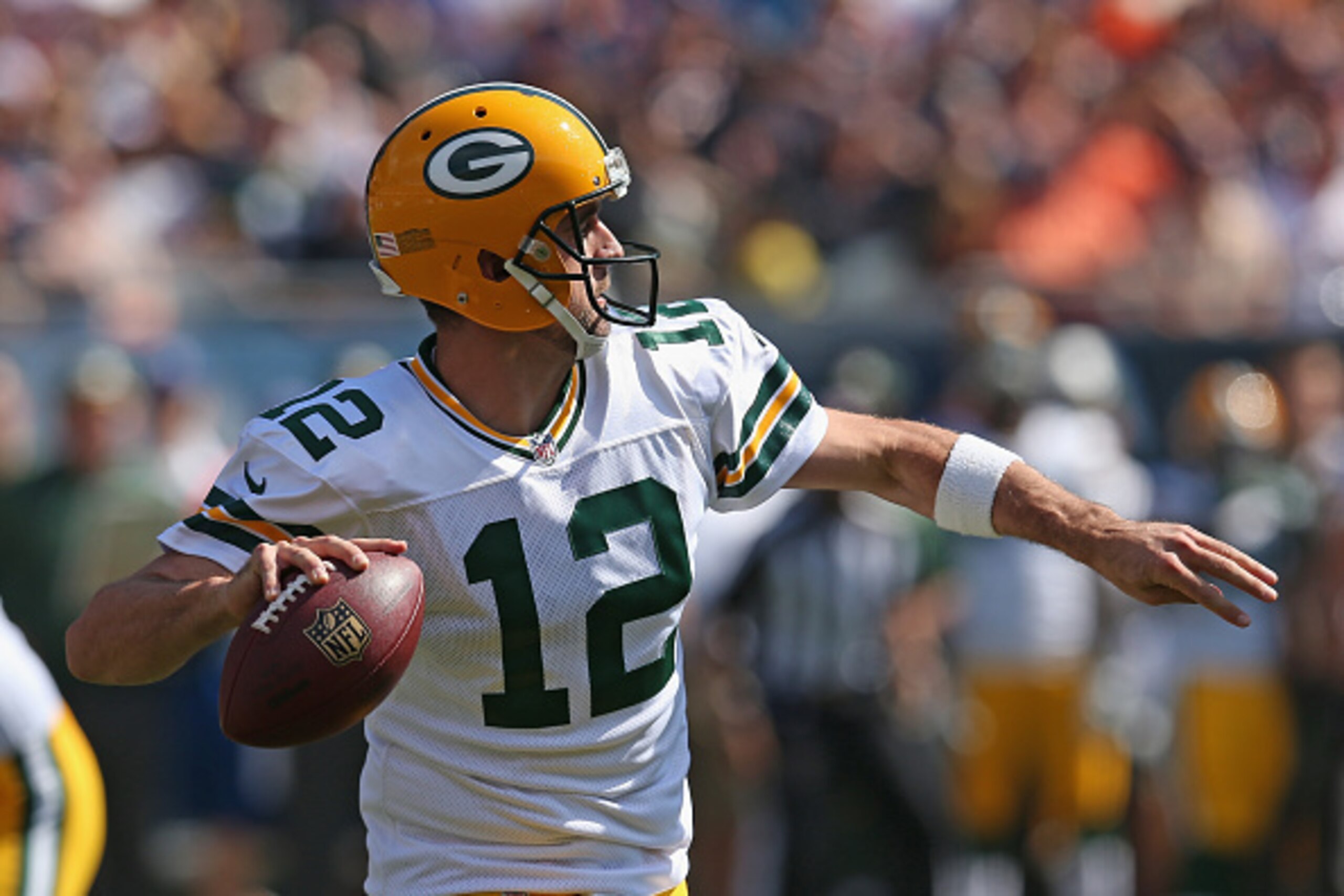 CHICAGO, IL - SEPTEMBER 28:  Aaron Rodgers #12 of the Green Bay Packers passes against the Chicago Bears at Soldier Field on September 28, 2014 in Chicago, Illinois. The Packers defeated the Bears 38-17.  (Photo by Jonathan Daniel/Getty Images)