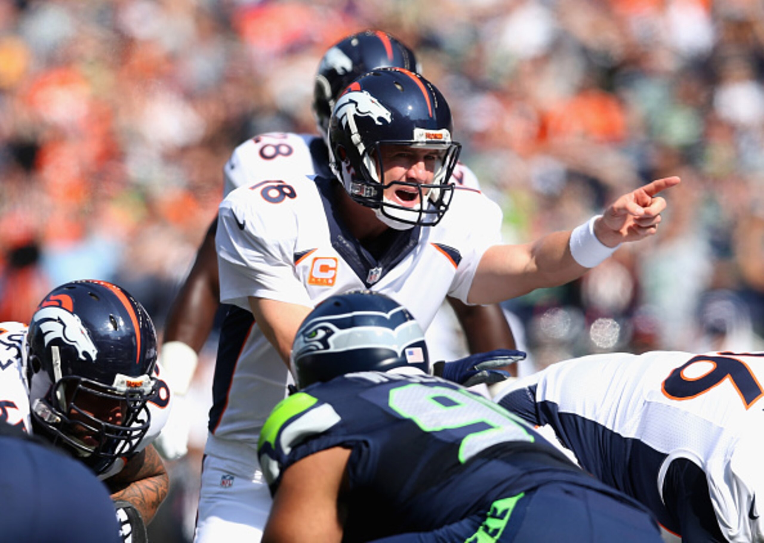 SEATTLE, WA - SEPTEMBER 21:  Quarterback Peyton Manning #18 of the Denver Broncos calls out a play against the Seattle Seahawks at CenturyLink Field on September 21, 2014 in Seattle, Washington.  (Photo by Jeff Gross/Getty Images)