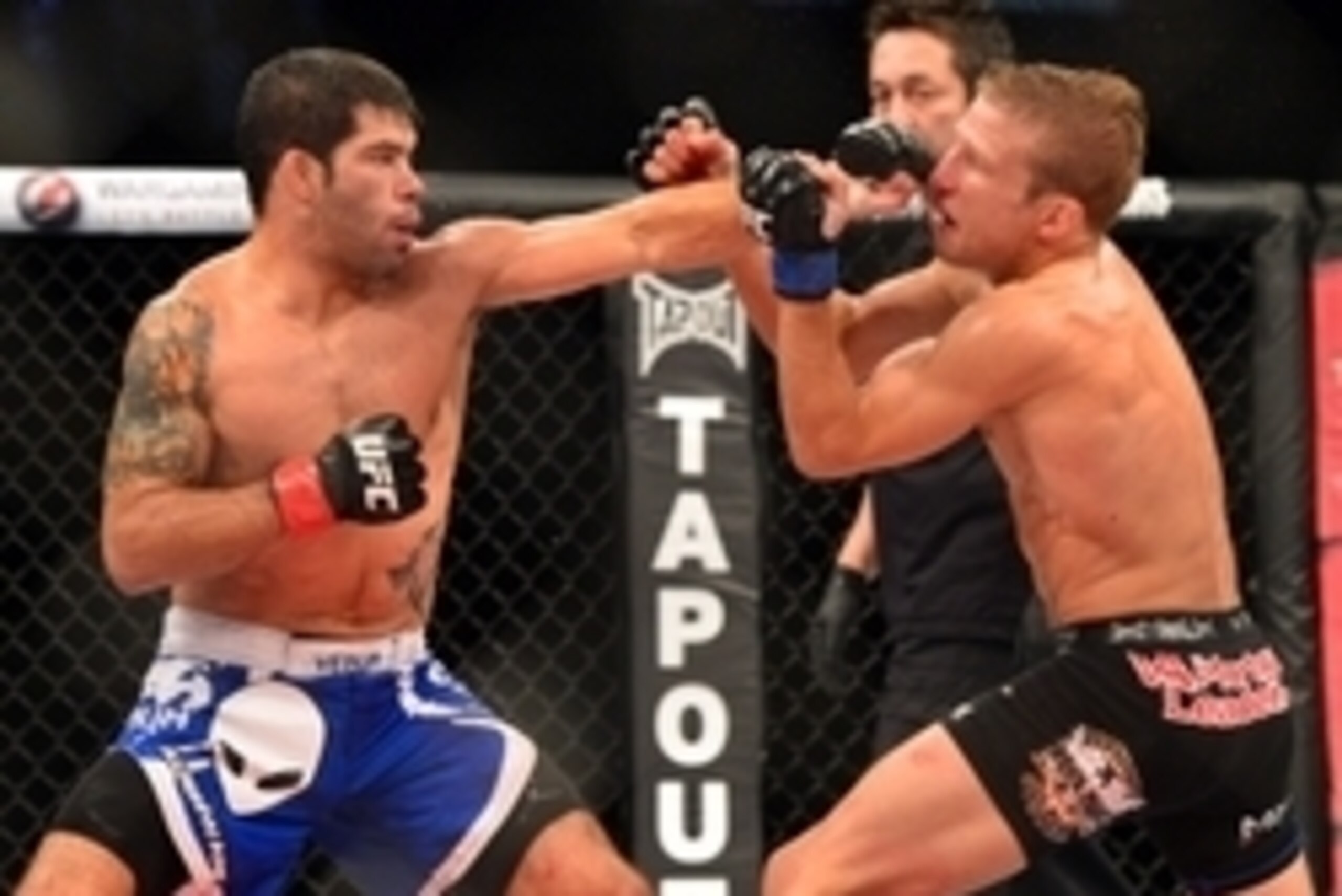 Oct 9, 2013; Barueri, Sao Paulo, Brazil; Raphael Assuncao  (blue shorts) fights against  TJ Dillashaw (black shorts) during UFC Fight Night 29 at Jose Correa Arena. Mandatory Credit: Jason Silva-USA TODAY Sports