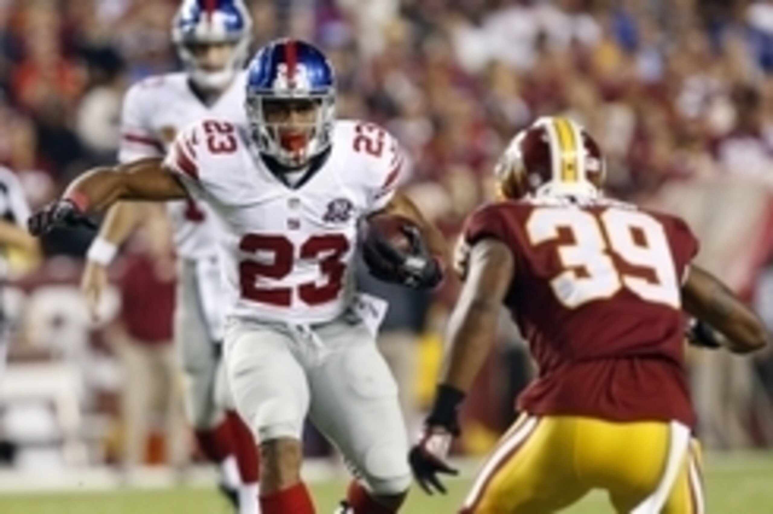 Sep 25, 2014; Landover, MD, USA; New York Giants running back Rashad Jennings (23) carries the ball as Washington Redskins cornerback David Amerson (39) defends in the first quarter at FedEx Field. Mandatory Credit: Geoff Burke-USA TODAY Sports