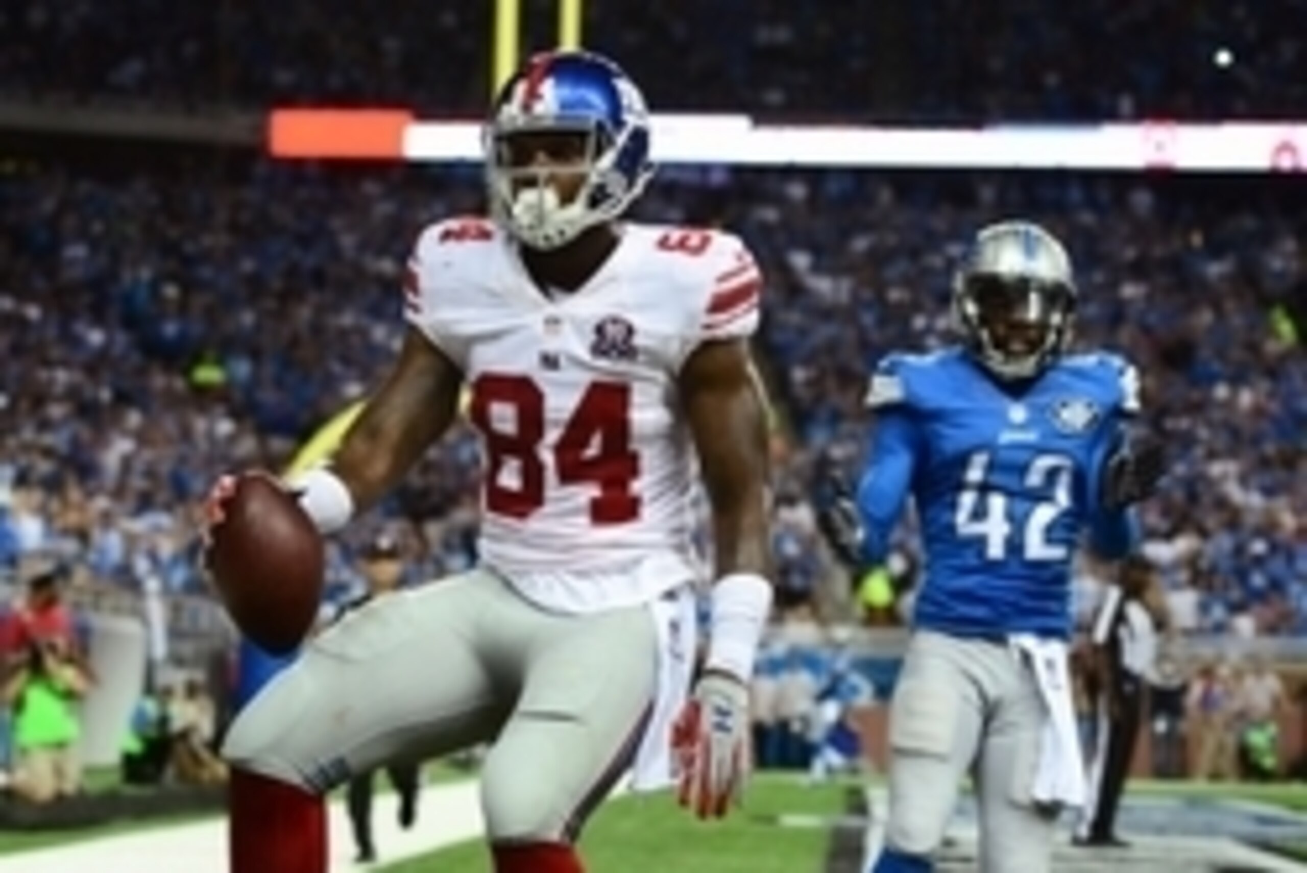 Sep 8, 2014; Detroit, MI, USA; New York Giants tight end Larry Donnell (84) makes a catch in the end zone for a touchdown while being defended by Detroit Lions free safety Isa Abdul-Quddus (42) during the second quarter at Ford Field. Mandatory Credit: An