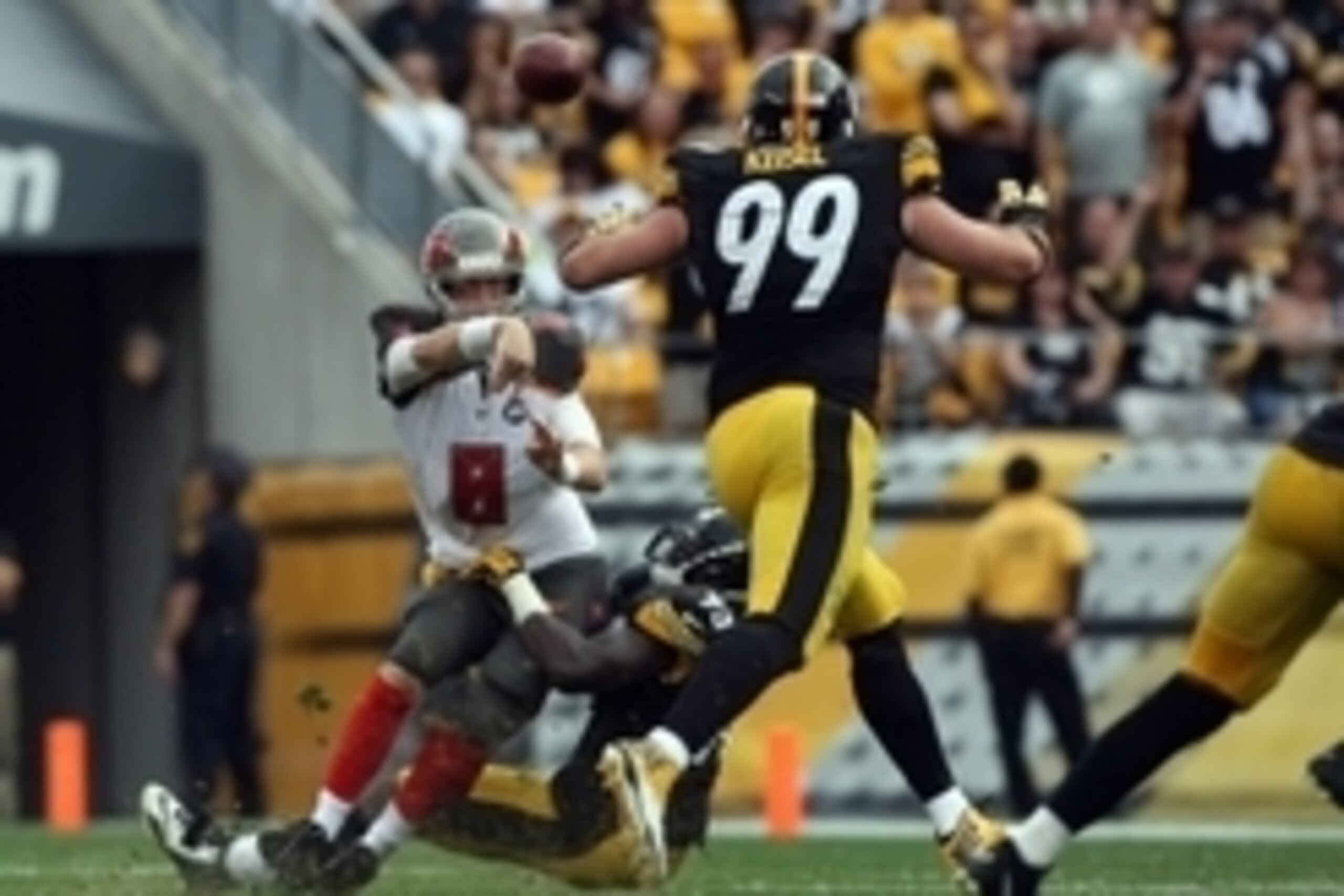 Sep 28, 2014; Pittsburgh, PA, USA; Tampa Bay Buccaneers quarterback Mike Glennon (8) throws a pass as he is hit by Pittsburgh Steelers linebacker Jason Worilds (93) and defensive end Brett Keisel (99) during the second half at Heinz Field. The Buccaneers 
