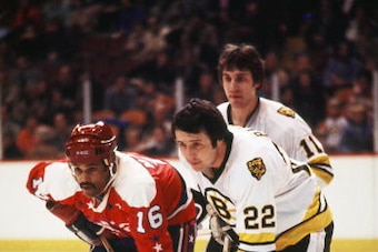 BOSTON, MA. - 1970's: Mike Marson #16 of the Washington Capitals plays against  Brad Park #22 of the Boston Bruins .  (Photo by Steve Babineau/NHLI via Getty Images)