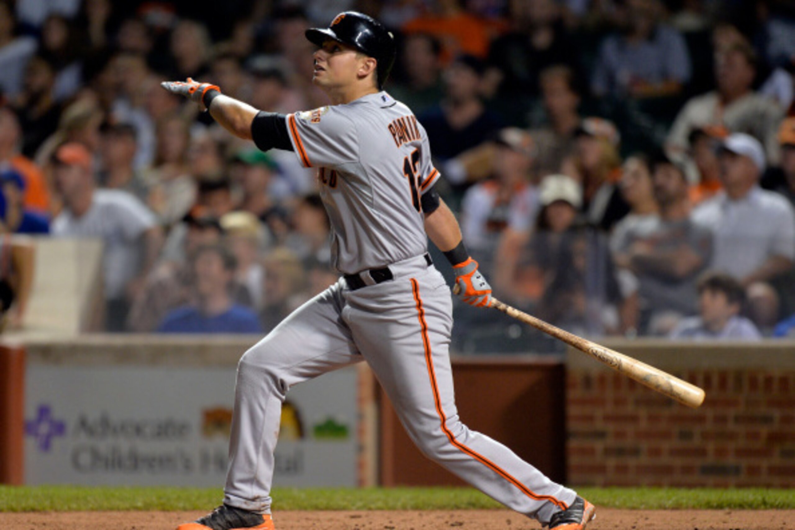 CHICAGO, IL - AUGUST 21:  Joe Panik #12 of the San Francisco Giants bats during the fifth inning against the Chicago Cubs at Wrigley Field on August 21, 2014 in Chicago, Illinois. The Giants defeated the Cubs 5-3.  (Photo by Brian Kersey/Getty Images)