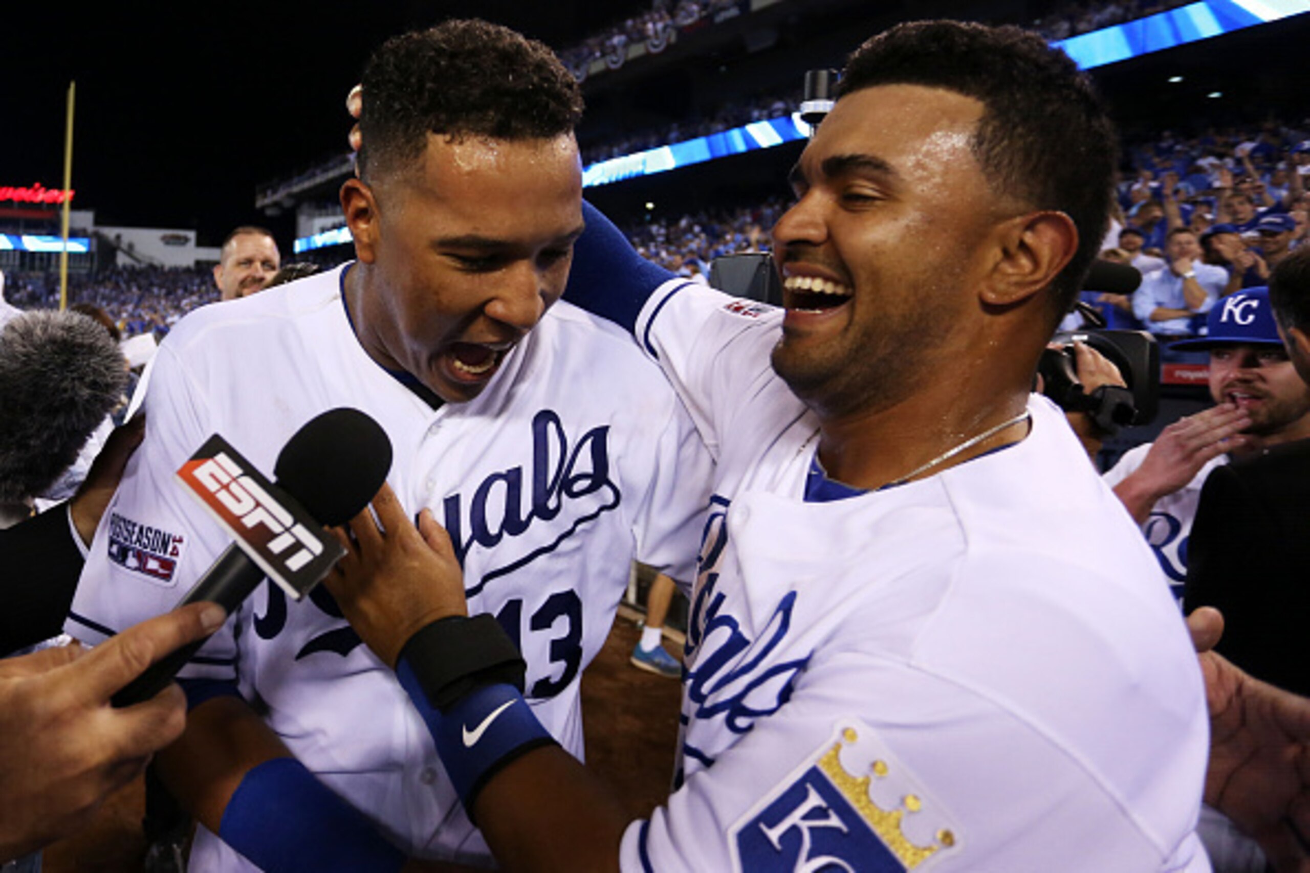 KANSAS CITY, MO - SEPTEMBER 30:  Salvador Perez #13 of the Kansas City Royals celebrates with teammates after they defeated the Oakland Athletics 9 to 8 in the 12th inning of their American League Wild Card game at Kauffman Stadium on September 30, 2014 i