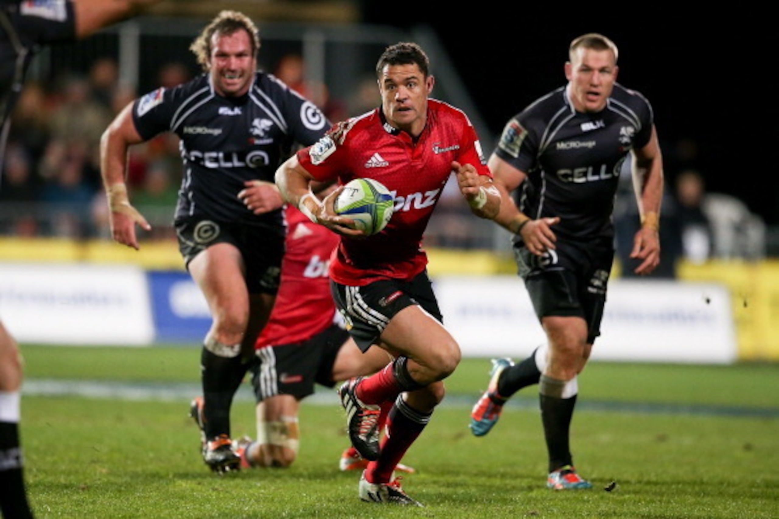 CHRISTCHURCH, NEW ZEALAND - JULY 26: Dan Carter of the Crusaders makes a break during the Super Ruby Semi Final match between the Crusaders and the Sharks at AMI Stadium on July 26, 2014 in Christchurch, New Zealand.  (Photo by Martin Hunter/Getty Images)
