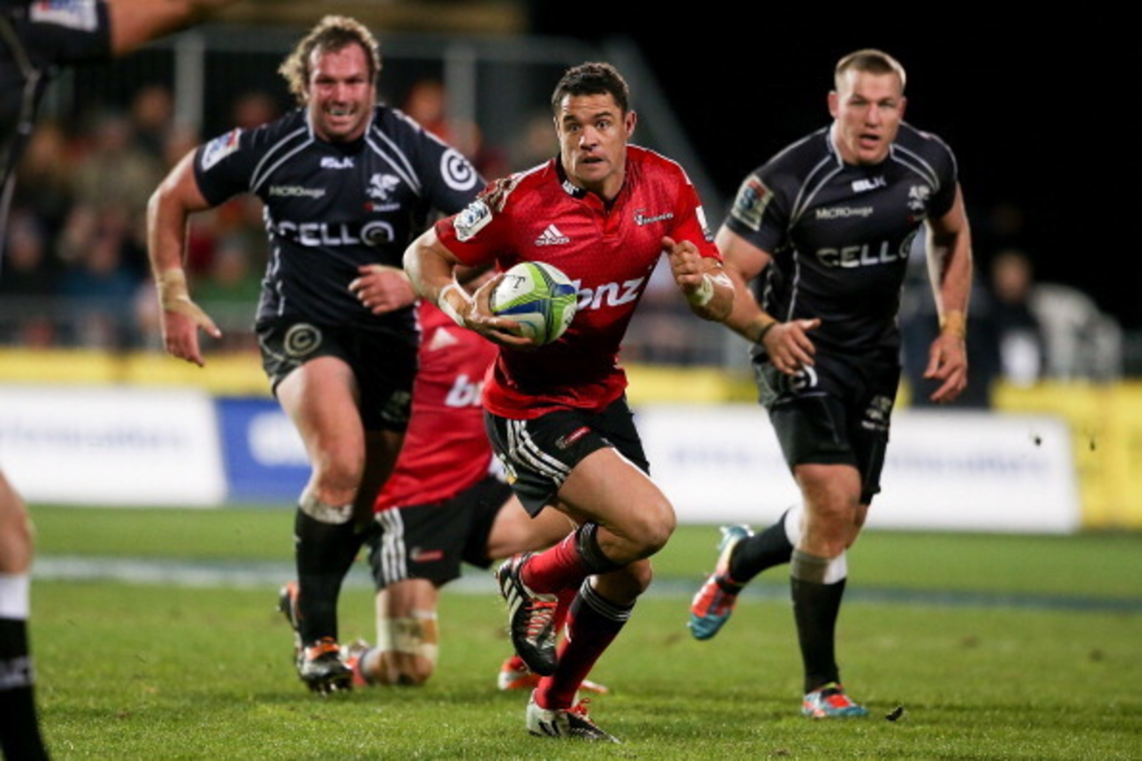 CHRISTCHURCH, NEW ZEALAND - JULY 26: Dan Carter of the Crusaders makes a break during the Super Ruby Semi Final match between the Crusaders and the Sharks at AMI Stadium on July 26, 2014 in Christchurch, New Zealand.  (Photo by Martin Hunter/Getty Images)