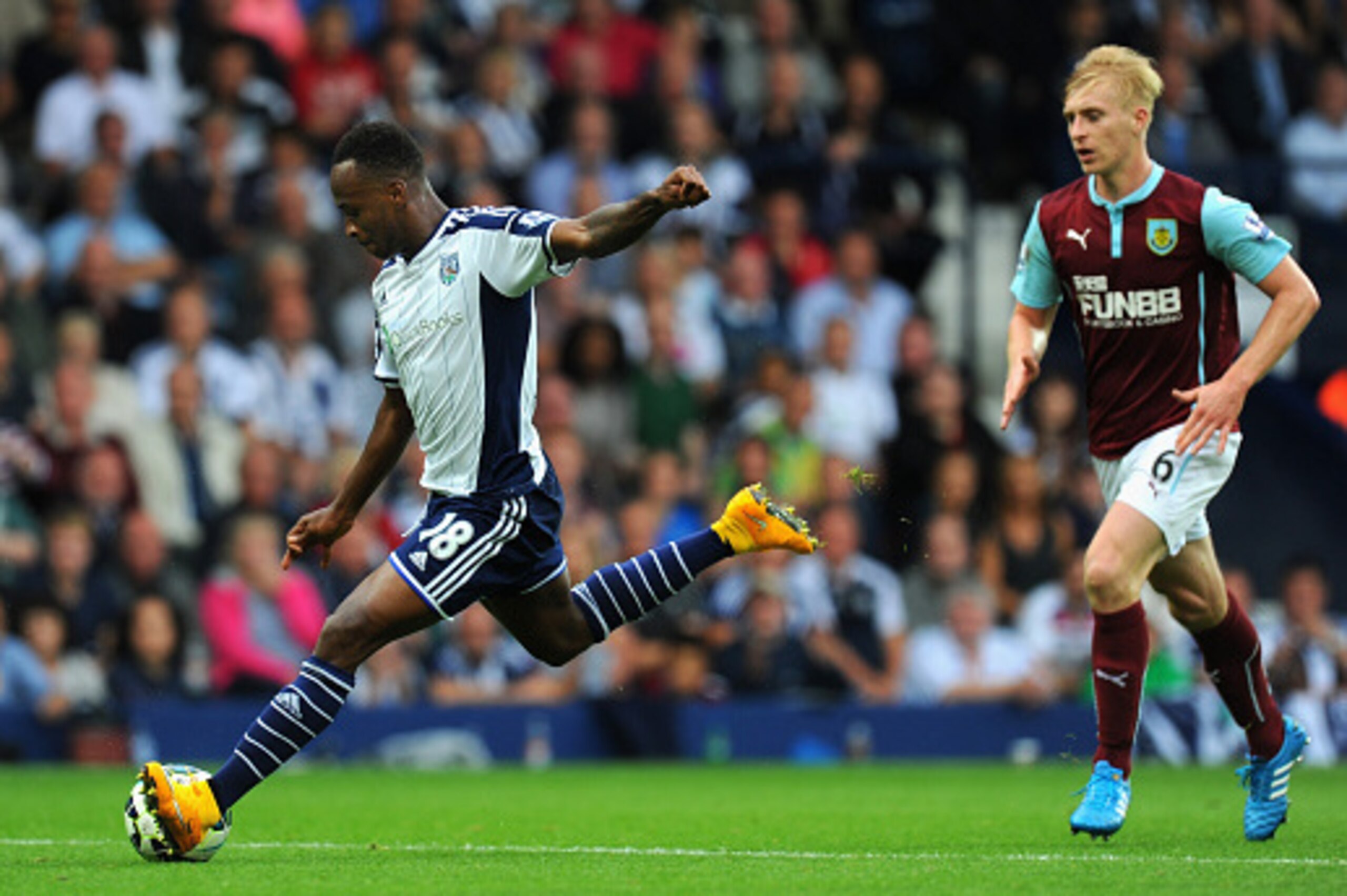 WEST BROMWICH, ENGLAND - SEPTEMBER 28:  WBA player Saido Berahino shoots to score the third goal during the Barclays Premier League match between West Bromwich Albion and Burnley at The Hawthorns on September 28, 2014 in West Bromwich, England.  (Photo by