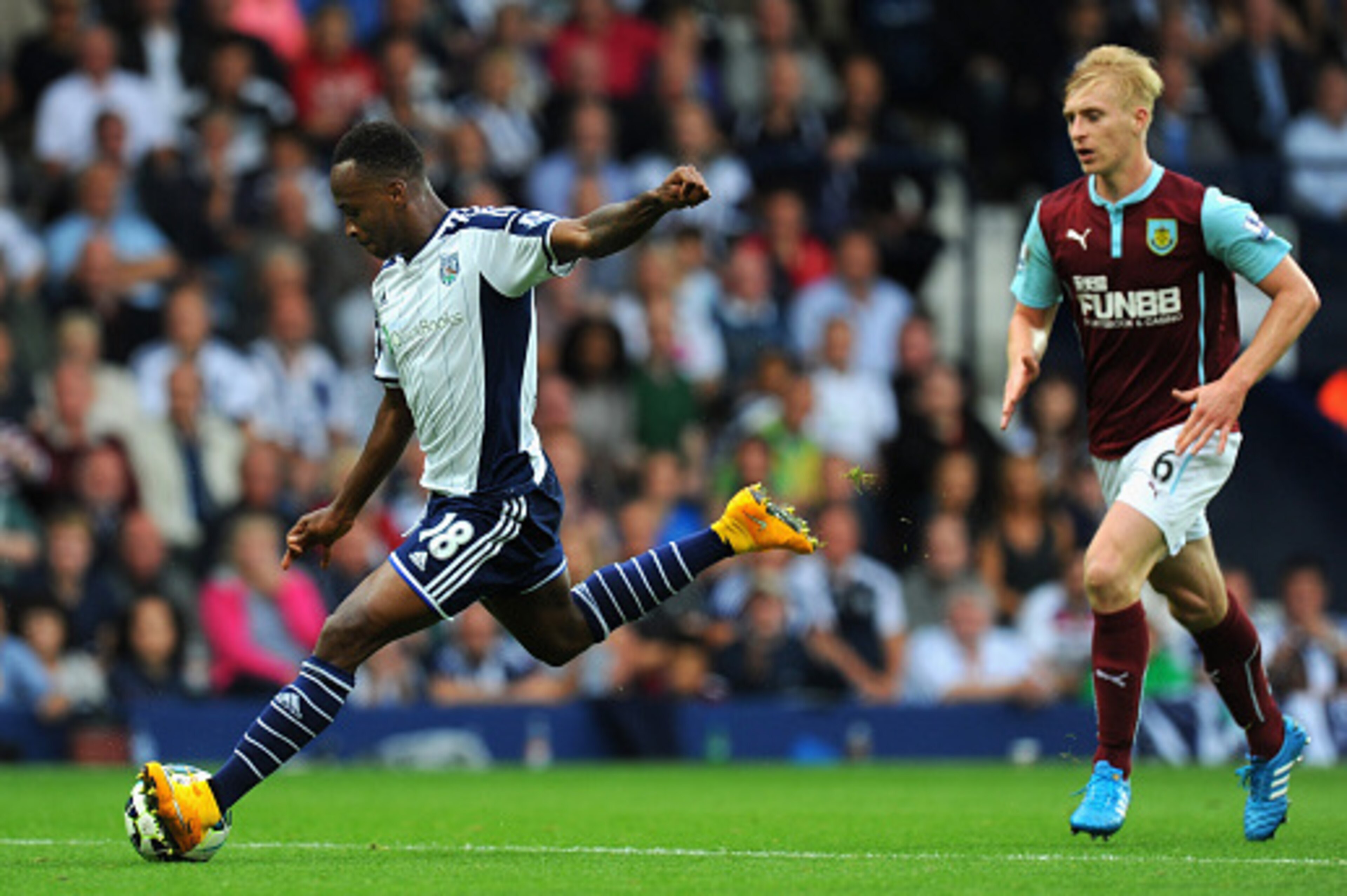 WEST BROMWICH, ENGLAND - SEPTEMBER 28:  WBA player Saido Berahino shoots to score the third goal during the Barclays Premier League match between West Bromwich Albion and Burnley at The Hawthorns on September 28, 2014 in West Bromwich, England.  (Photo by