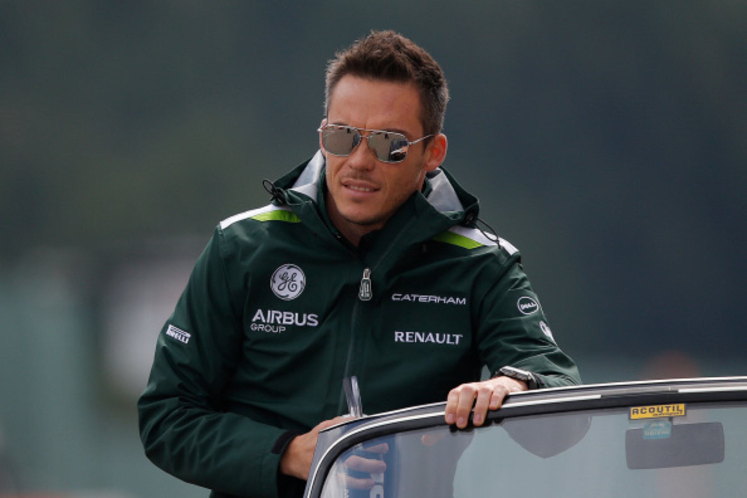 SPA, BELGIUM - AUGUST 24:  Andre Lotterer of Germany and Caterham looks on during the drivers' parade before the Belgian Grand Prix at Circuit de Spa-Francorchamps on August 24, 2014 in Spa, Belgium.  (Photo by Dean Mouhtaropoulos/Getty Images)