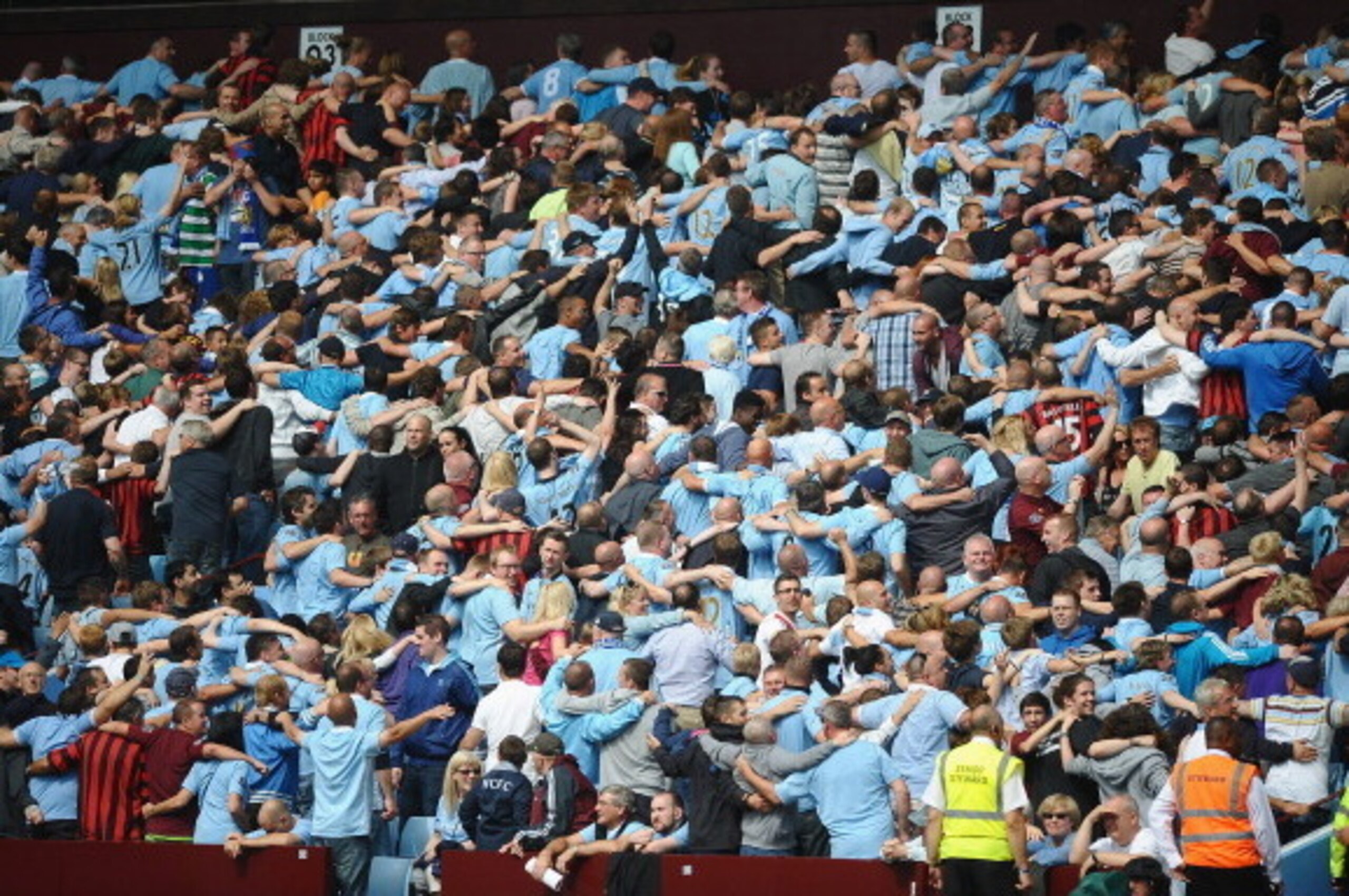 BIRMINGHAM, ENGLAND - AUGUST 12:  Manchester City fans do the Poznan celebration during the FA Community Shield match between Manchester City and Chelsea at Villa Park on August 12, 2012 in Birmingham, England.  (Photo by Laurence Griffiths/Getty Images)