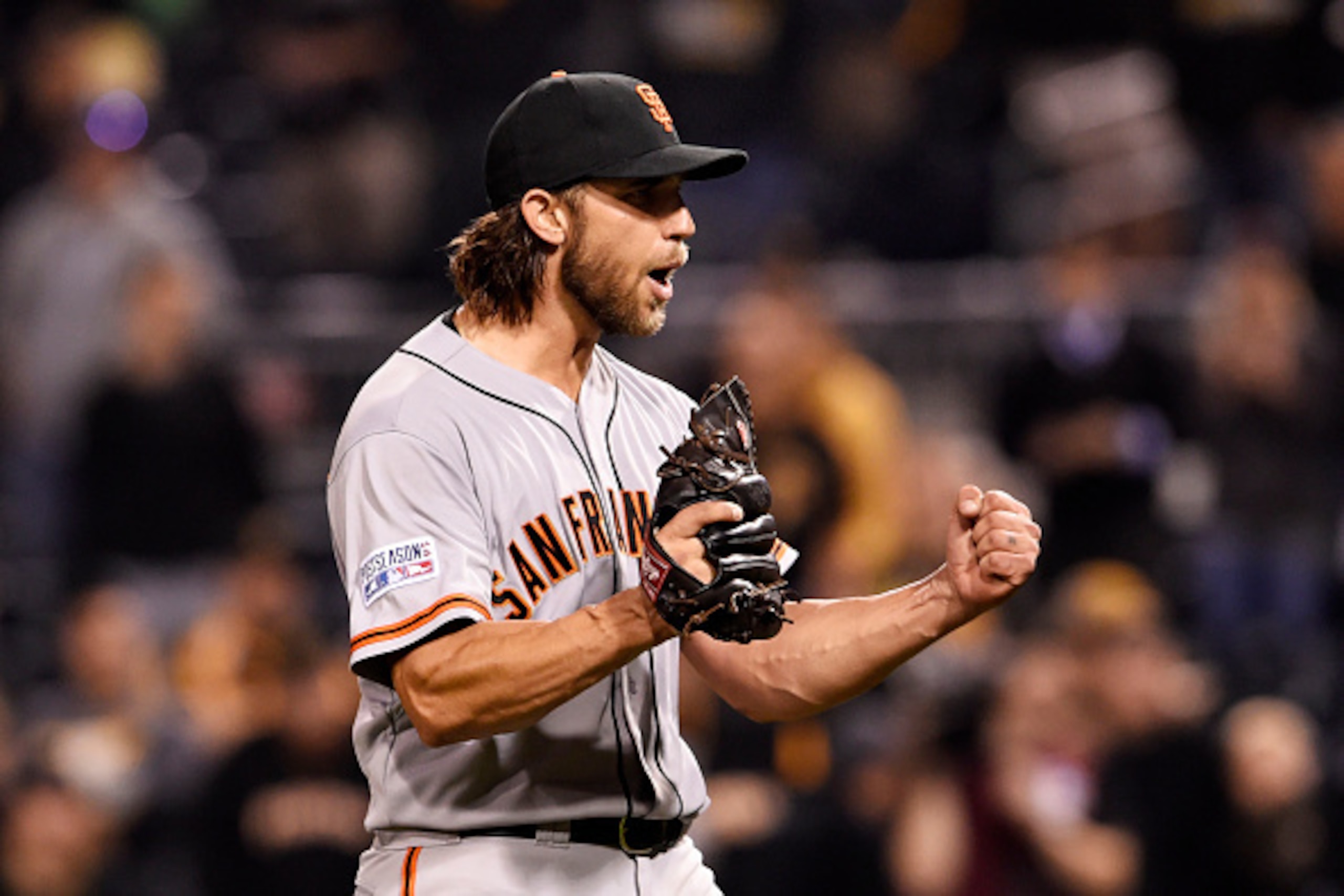 PITTSBURGH, PA - OCTOBER 01:  Madison Bumgarner #40 of the San Francisco Giants celebrates their 8 to 0 win over the Pittsburgh Pirates during the National League Wild Card game at PNC Park on October 1, 2014 in Pittsburgh, Pennsylvania.  (Photo by Jason 