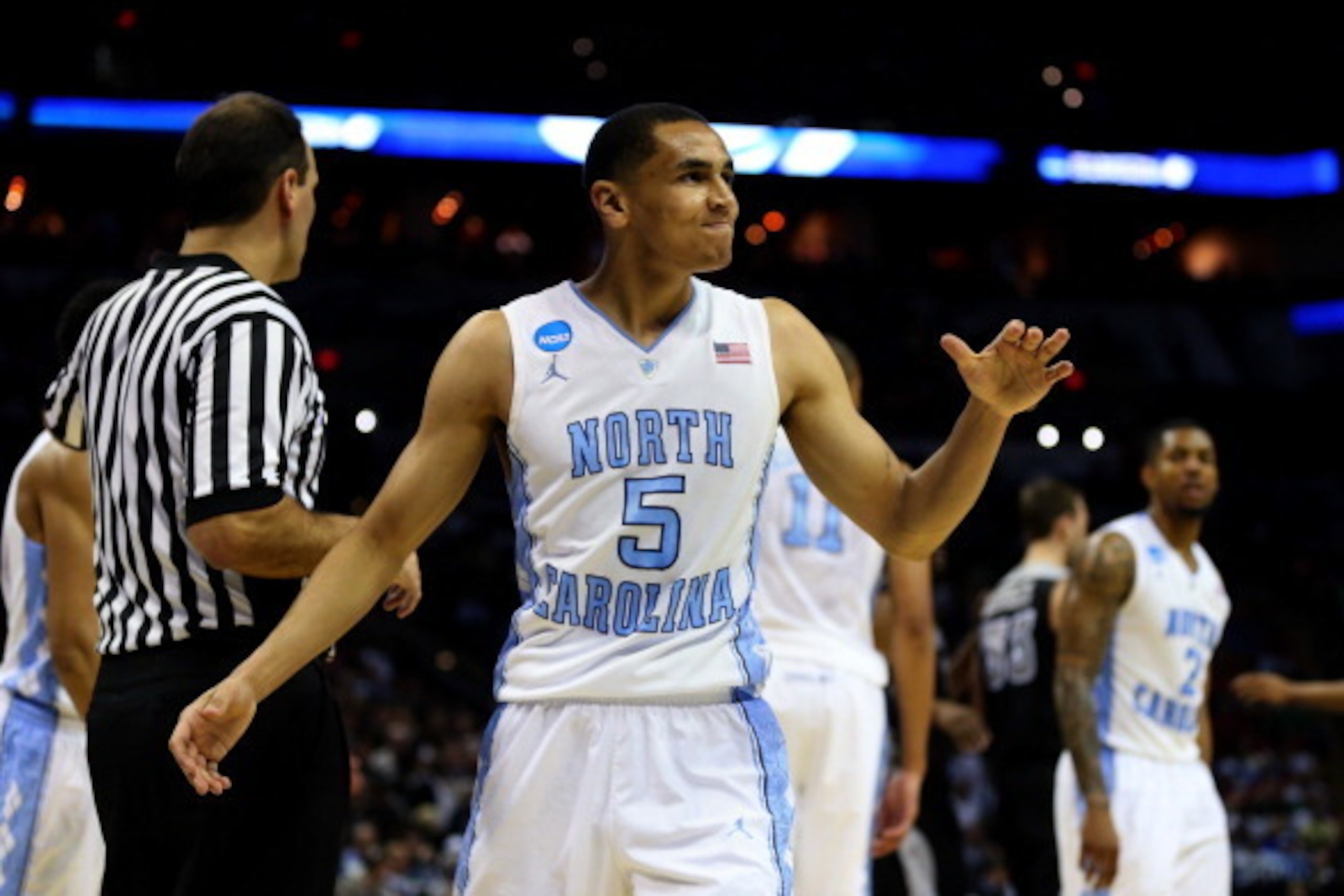 SAN ANTONIO, TX - MARCH 21: Marcus Paige #5 of the North Carolina Tar Heels celebrates during the closing moments of the Tar Heels 79-77 win over the Providence Friars during the second round of the 2014 NCAA Men's Basketball Tournament at AT&T Center on SAN ANTONIO, TX - MARCH 21: Marcus Paige #5 of the North Carolina Tar Heels celebrates during the closing moments of the Tar Heels 79-77 win over the Providence Friars during the second round of the 2014 NCAA Men's Basketball Tournament at AT&T Center on