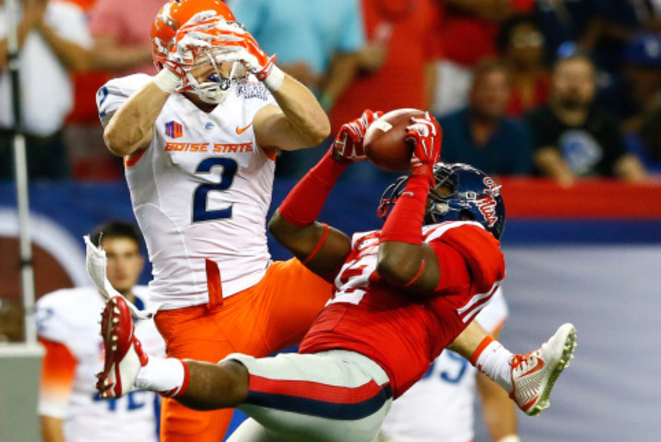 ATLANTA, GA - AUGUST 28:  Tony Conner #12 of the Mississippi Rebels intercepts this pass intended for Matt Miller #2 of the Boise State Broncos at Georgia Dome on August 28, 2014 in Atlanta, Georgia.  (Photo by Kevin C. Cox/Getty Images)