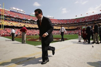 LANDOVER, MD - SEPTEMBER 12:  Owner Dan Snyder of the Washington Redskins jogs off the field before NFL week one game against the Tampa Bay Buccaneers at FedEx Field on September 12, 2004 in Landover, Maryland. Redskins defeated the Buccaneers 16-10.  (Ph