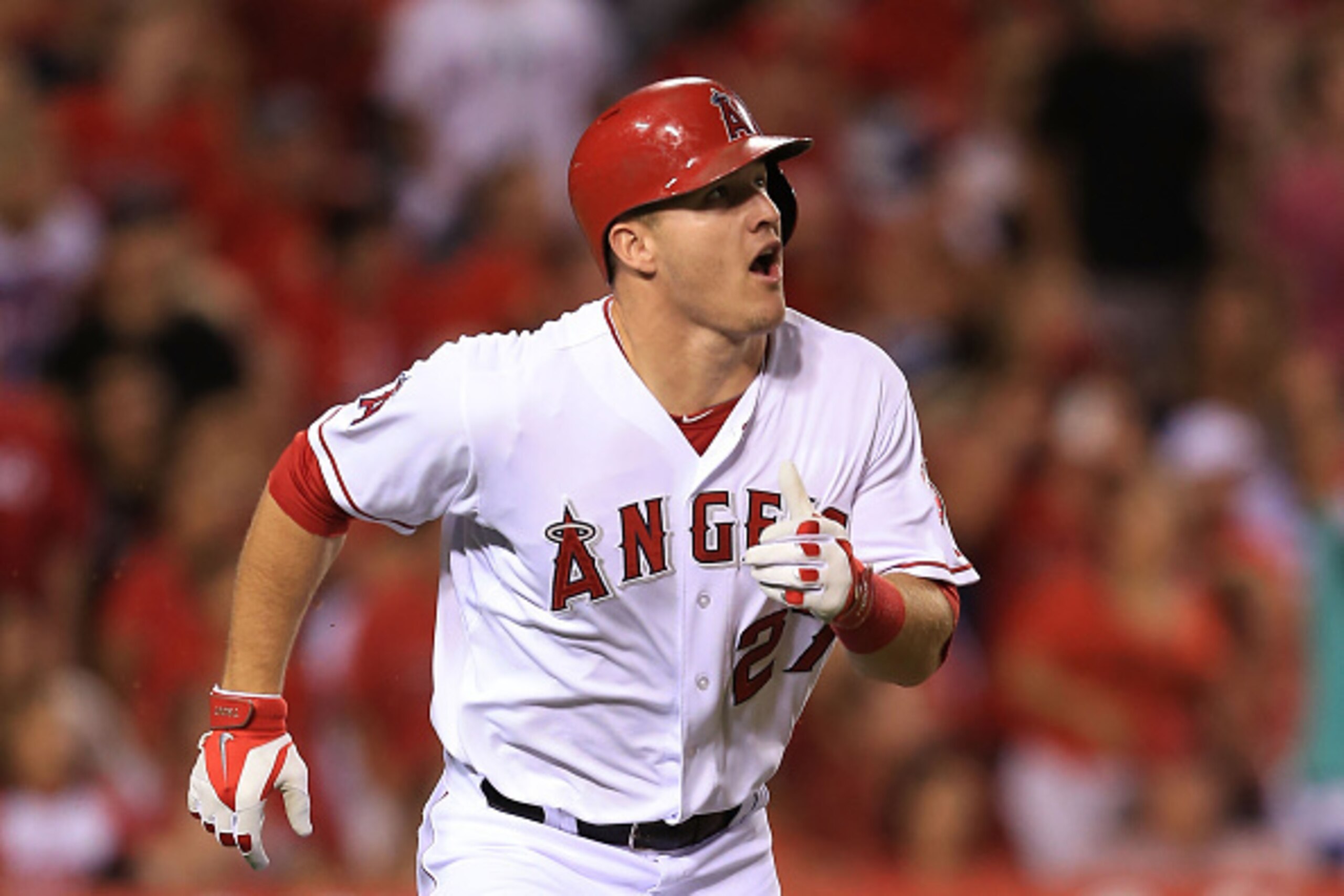 ANAHEIM, CA - SEPTEMBER 20: Mike Trout #27 of the Los Angeles Angels of Anaheim watches his hit for a triple go to the right center field in the fifth inning during the MLB game against the Texas Rangers at Angel Stadium of Anaheim on September 20, 2014 i