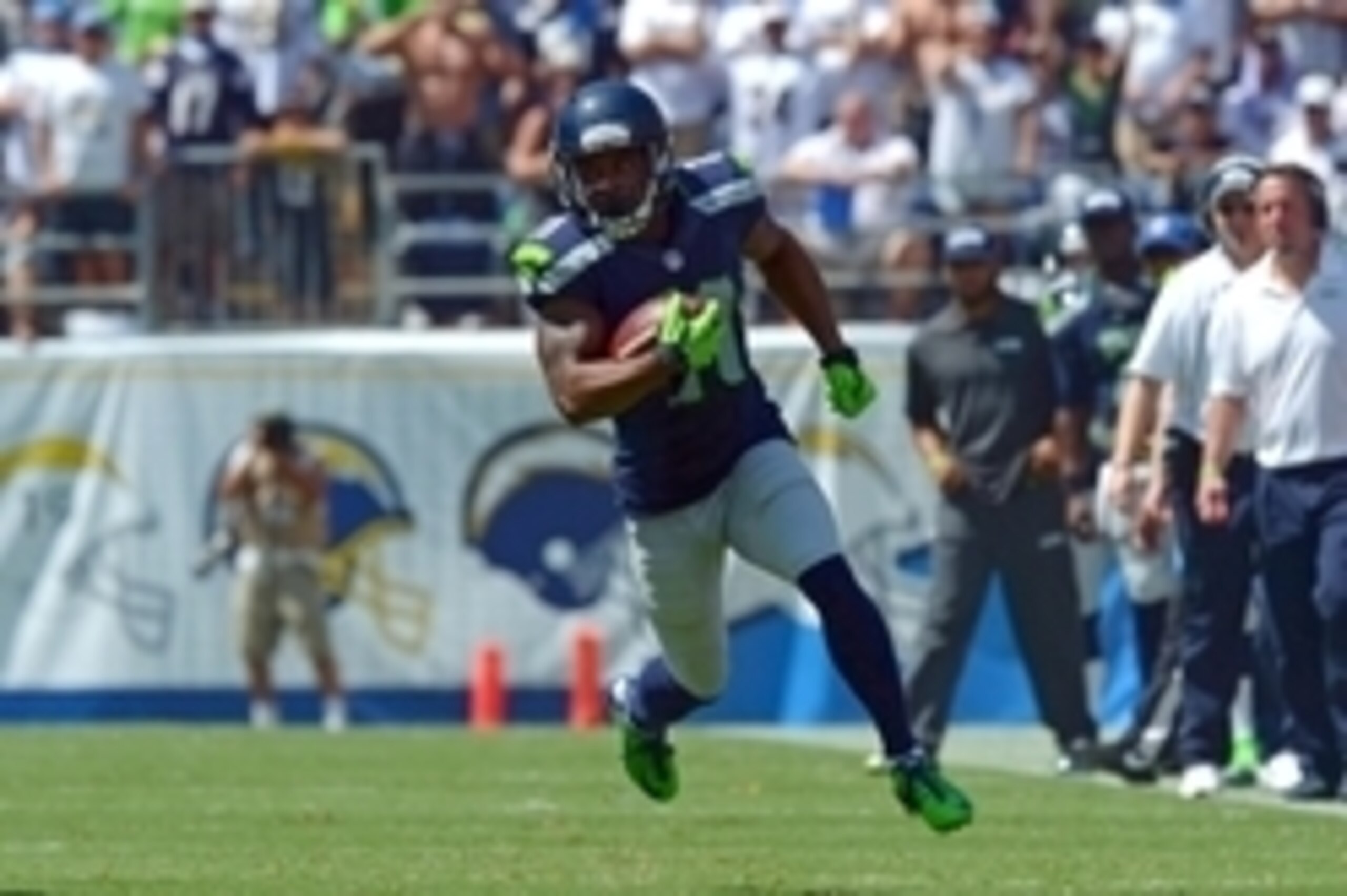 Sep 14, 2014; San Diego, CA, USA; Seattle Seahawks wide receiver Percy Harvin (11) runs for a touchdown during the first quarter against the San Diego Chargers at Qualcomm Stadium. Mandatory Credit: Jake Roth-USA TODAY Sports