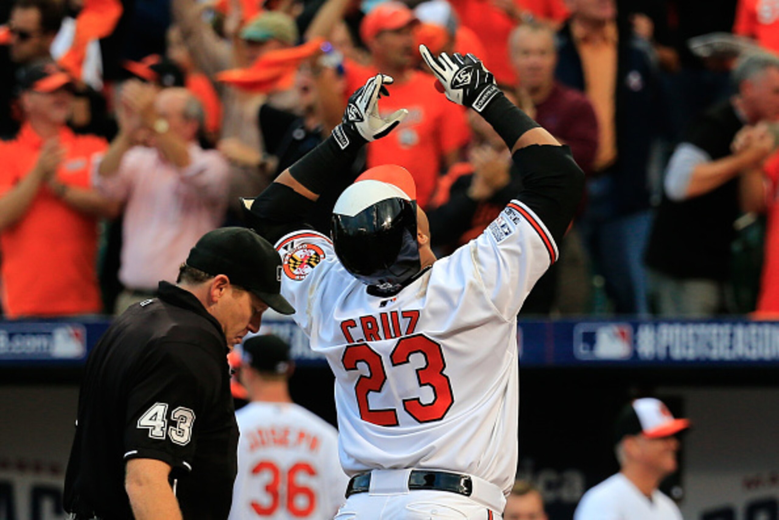 BALTIMORE, MD - OCTOBER 02:  Nelson Cruz #23 of the Baltimore Orioles celebrates after hitting a two run home run to right center field against Max Scherzer #37 of the Detroit Tigers in the first inning during Game One of the American League Division Seri