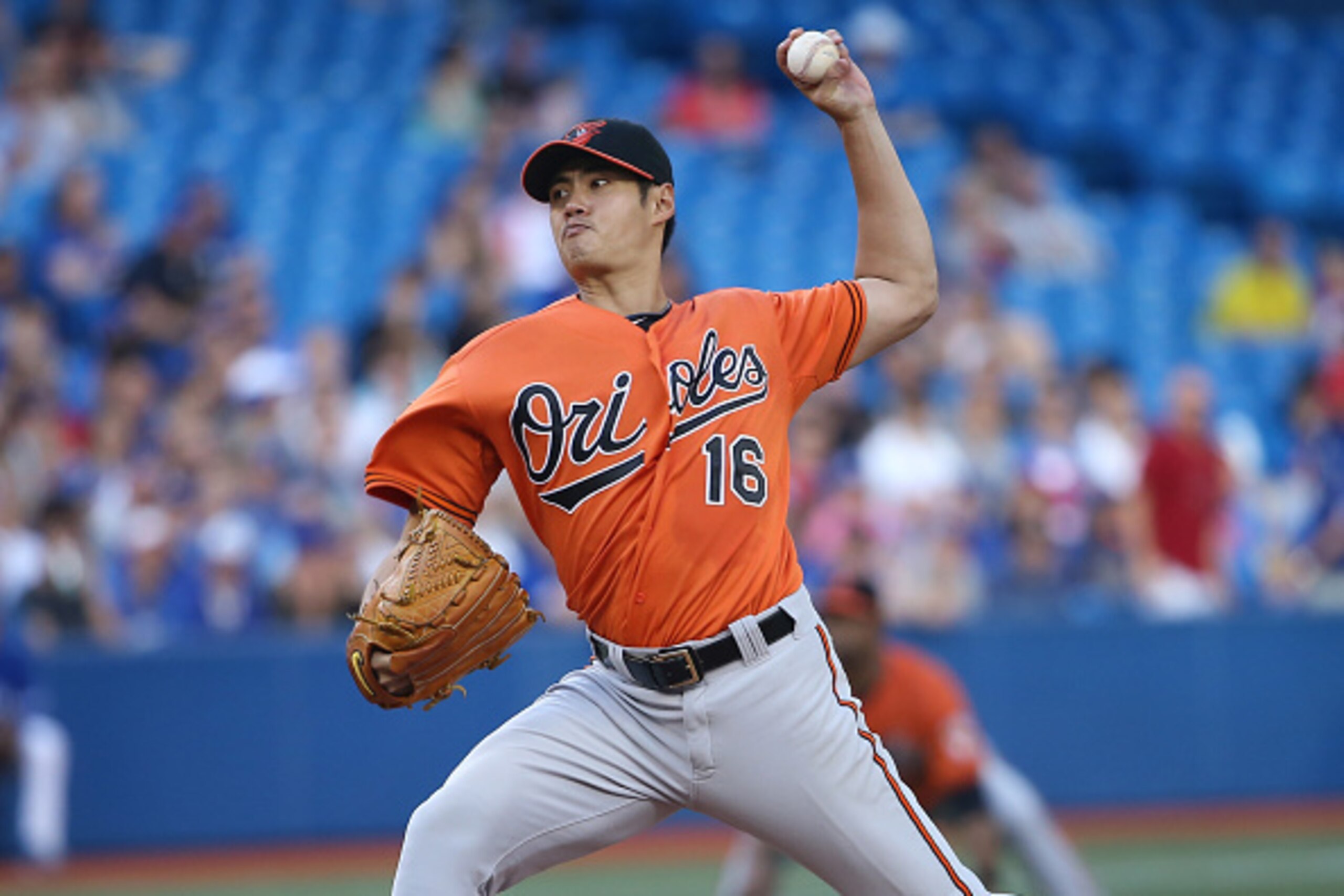 TORONTO, CANADA - SEPTEMBER 27: Wei-Yin Chen #16 of the Baltimore Orioles delivers a pitch in the fifth inning during MLB game action against the Toronto Blue Jays on September 27, 2014 at Rogers Centre in Toronto, Ontario, Canada. (Photo by Tom Szczerbow