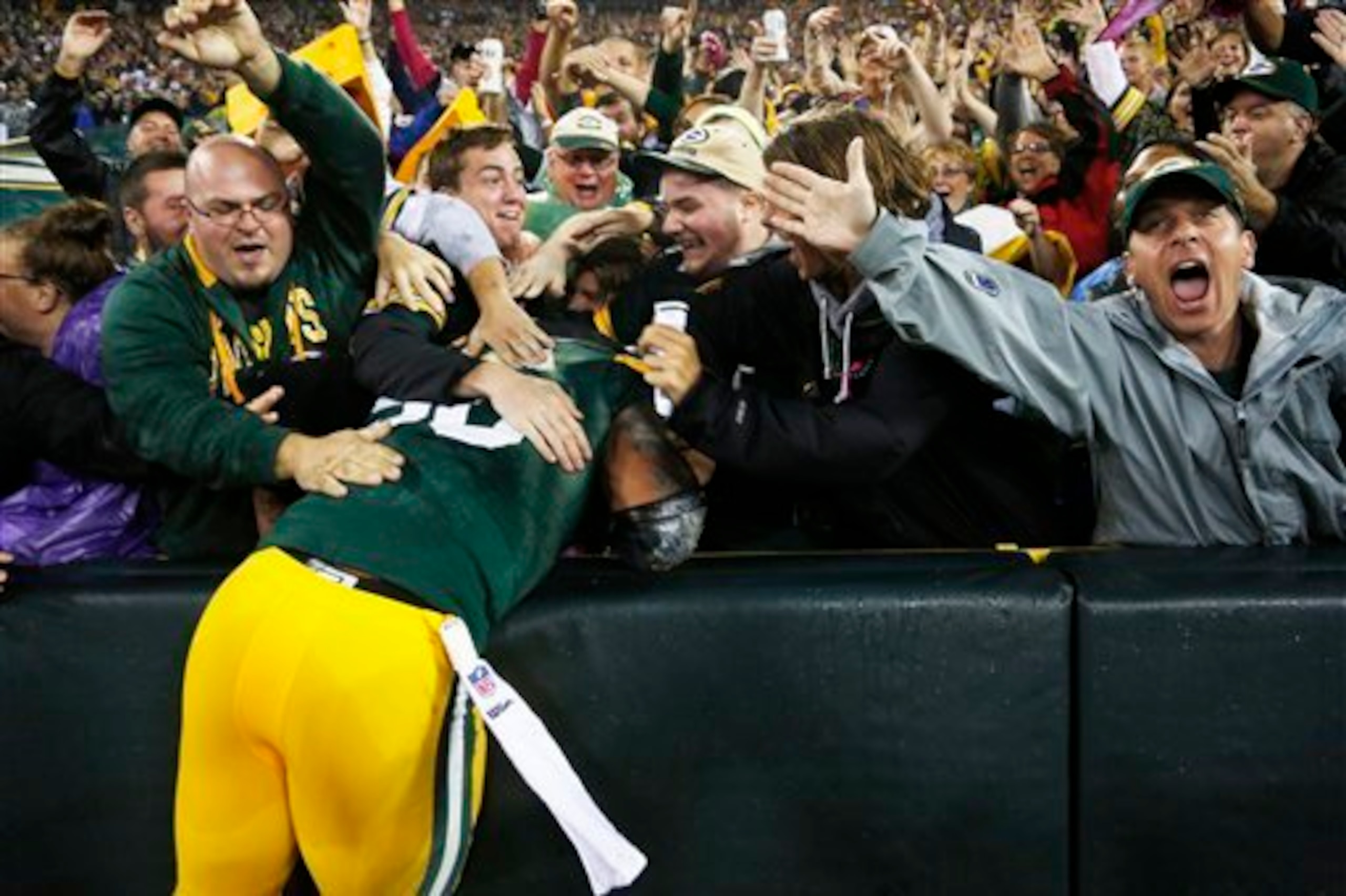 Peppers goes in for his first Lambeau Leap.