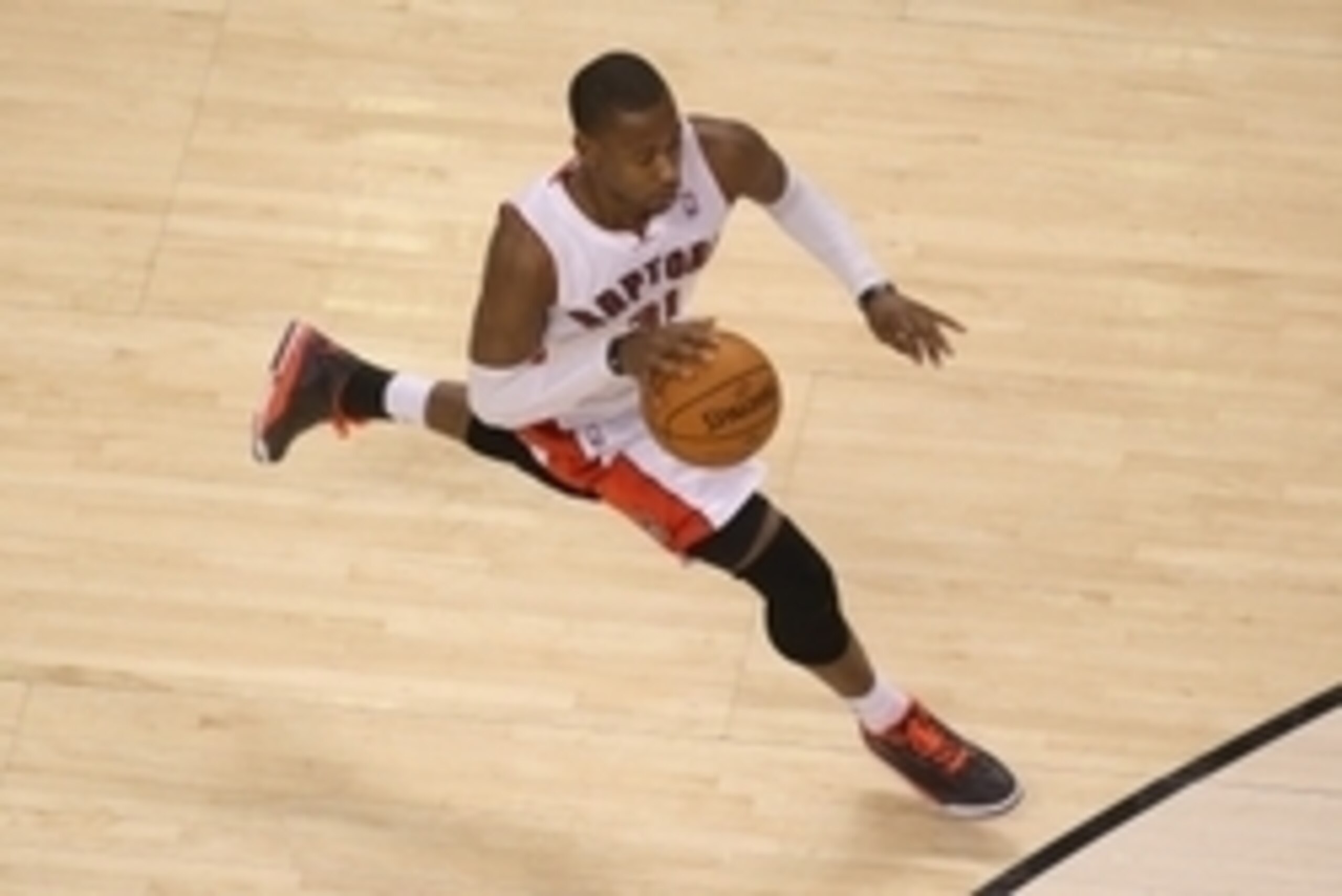 Apr 2, 2014; Toronto, Ontario, CAN; Toronto Raptors guard Terrence Ross (31) dribbles against the Houston Rockets at Air Canada Centre. The Raptors beat the Rockets 107-103. Mandatory Credit: Tom Szczerbowski-USA TODAY Sports