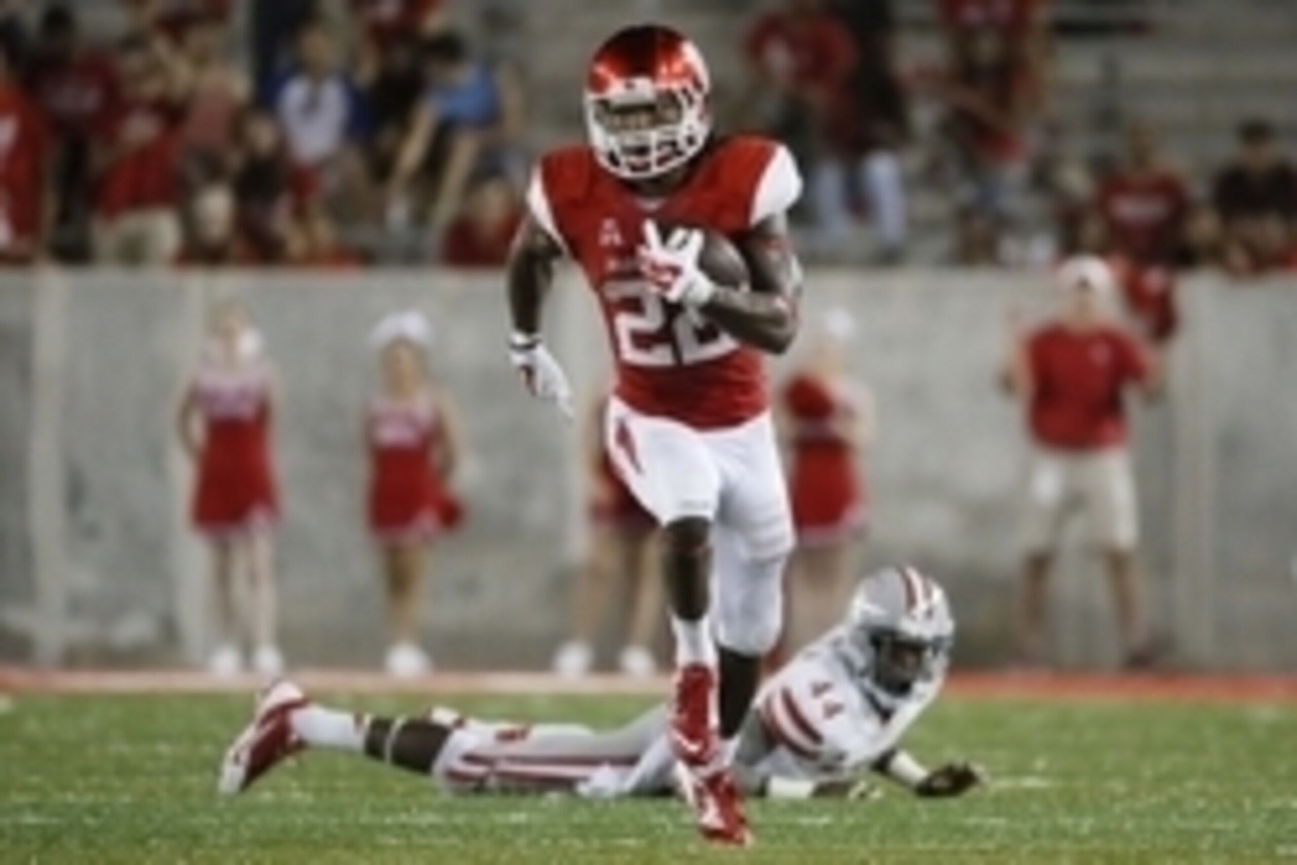 Sep 20, 2014; Houston, TX, USA; Houston Cougars running back Ryan Jackson (22) carries the ball against the UNLV Rebels during the second half at TDECU Stadium. Mandatory Credit: Soobum Im-USA TODAY Sports